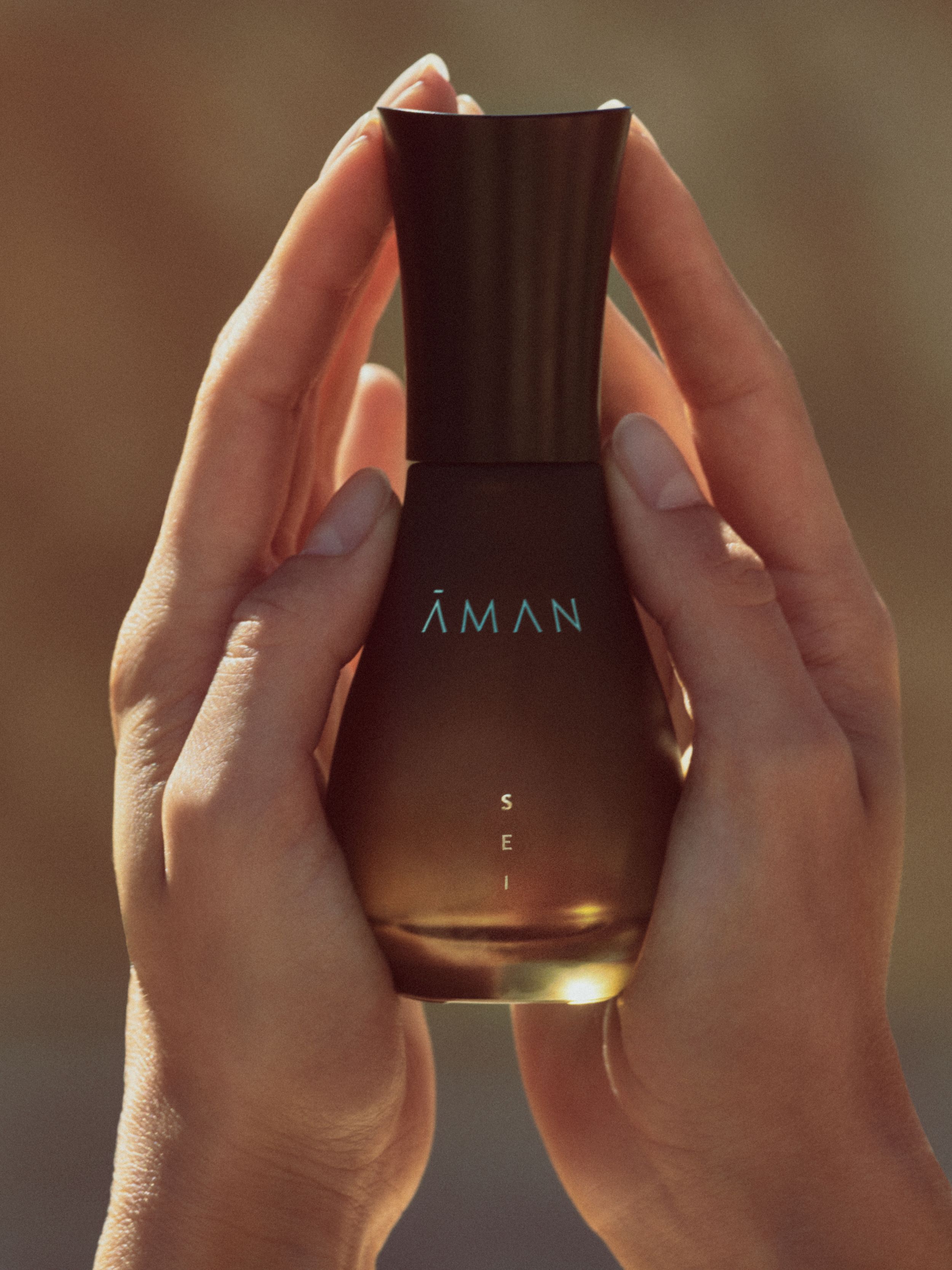 Aman Sei fragrance held in hands at Amangiri. Photographed by Chris Colls.