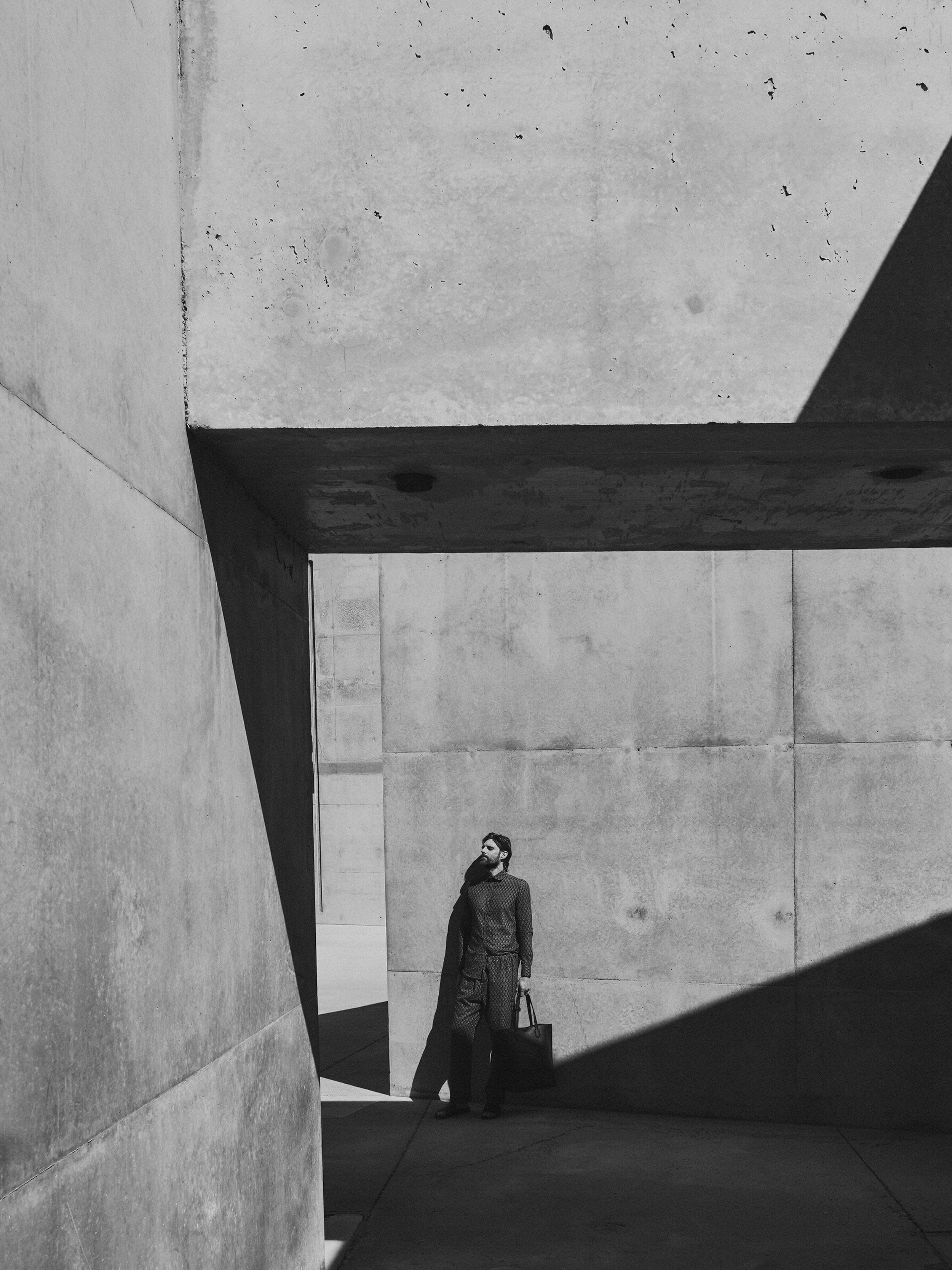 A model at peace, reclining against the sheltered walls of Amangiri, in the Utah desert. Photography by Chris Colls, Art Direction by Colville-Walker.