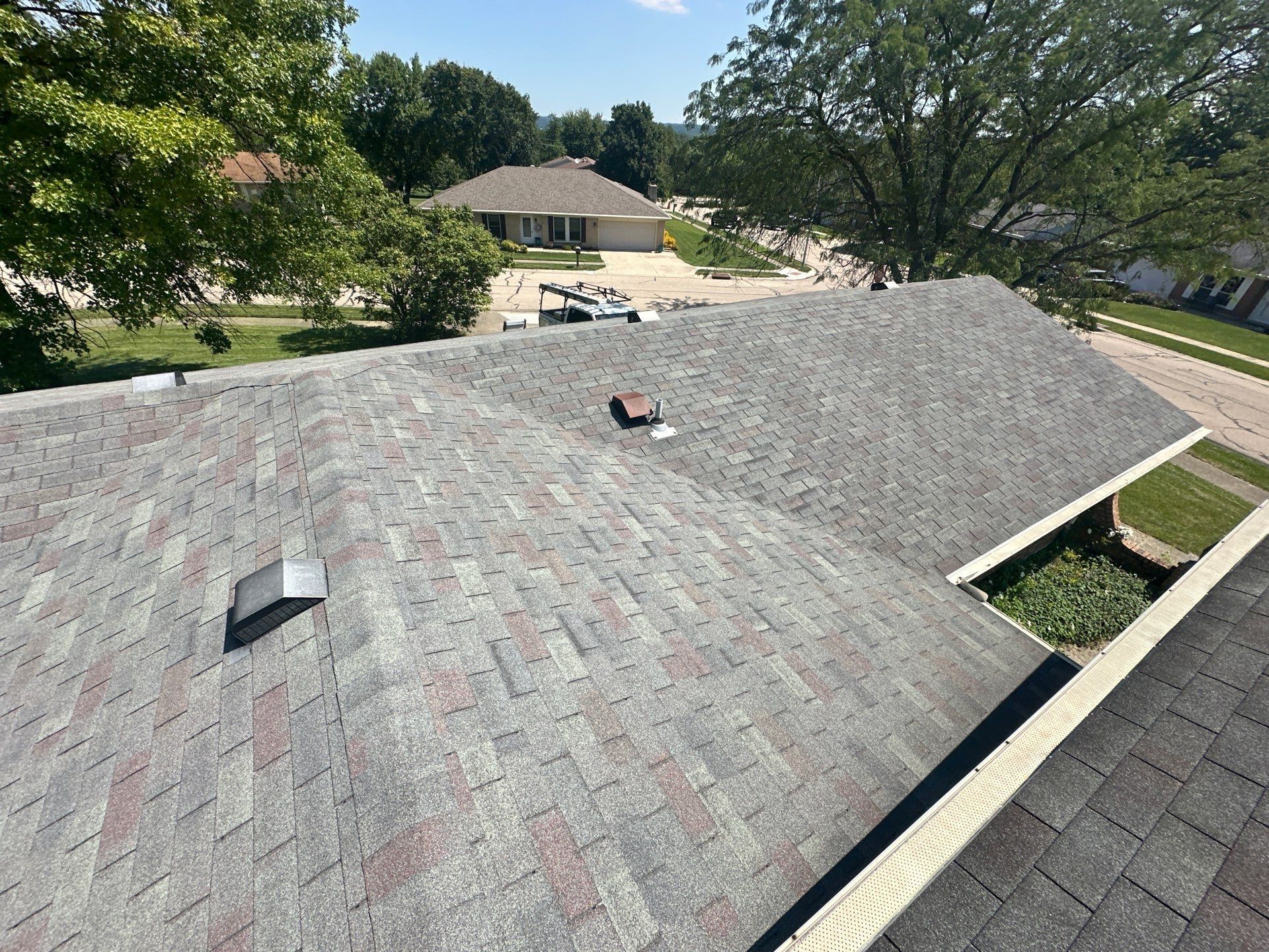 Two box vents on the old hip roof, above the gutter, West Carrollton, Ohio.