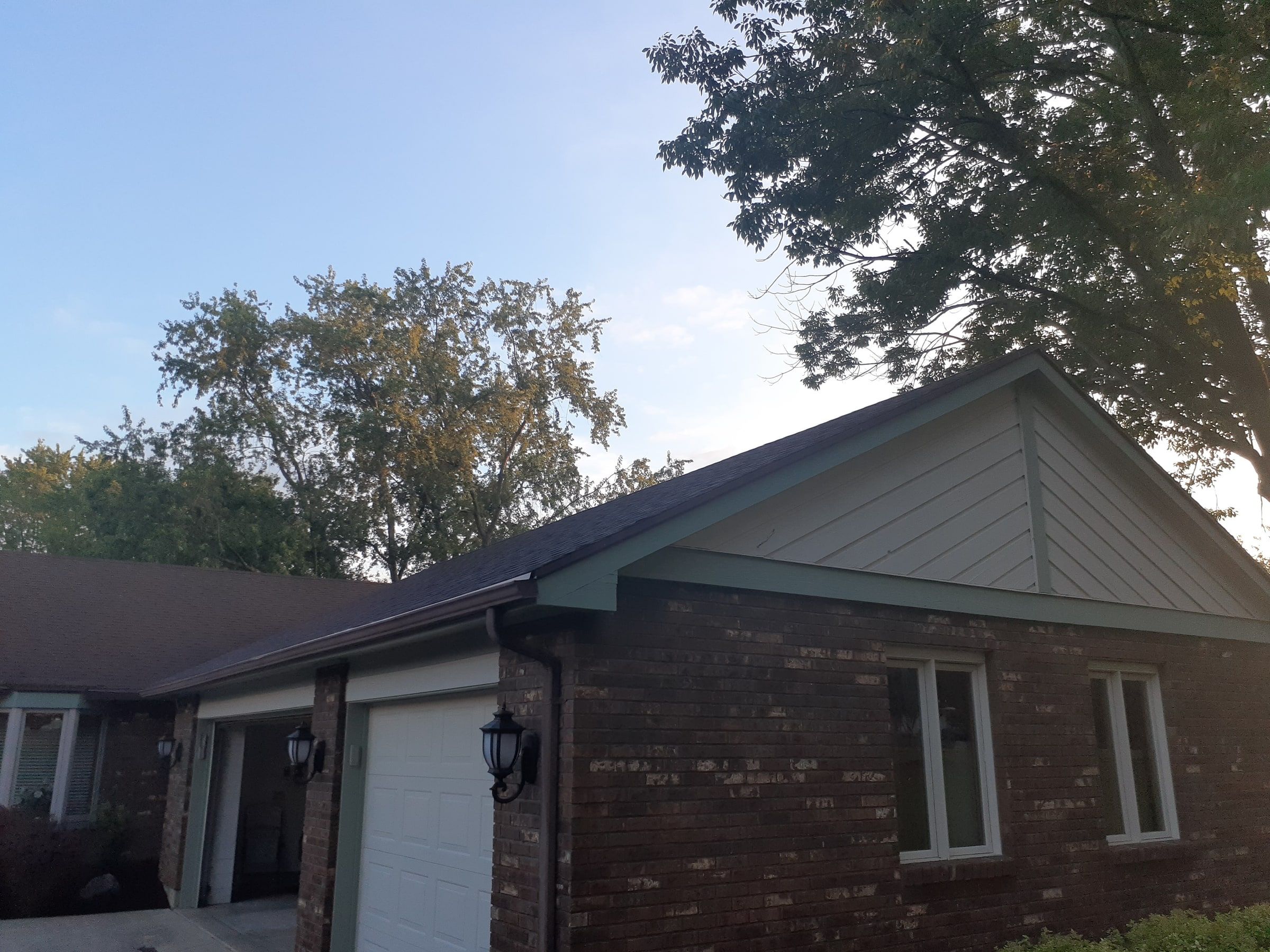 Garage end of the brick ranch house with the old roof before work began, Jamestown, Ohio.