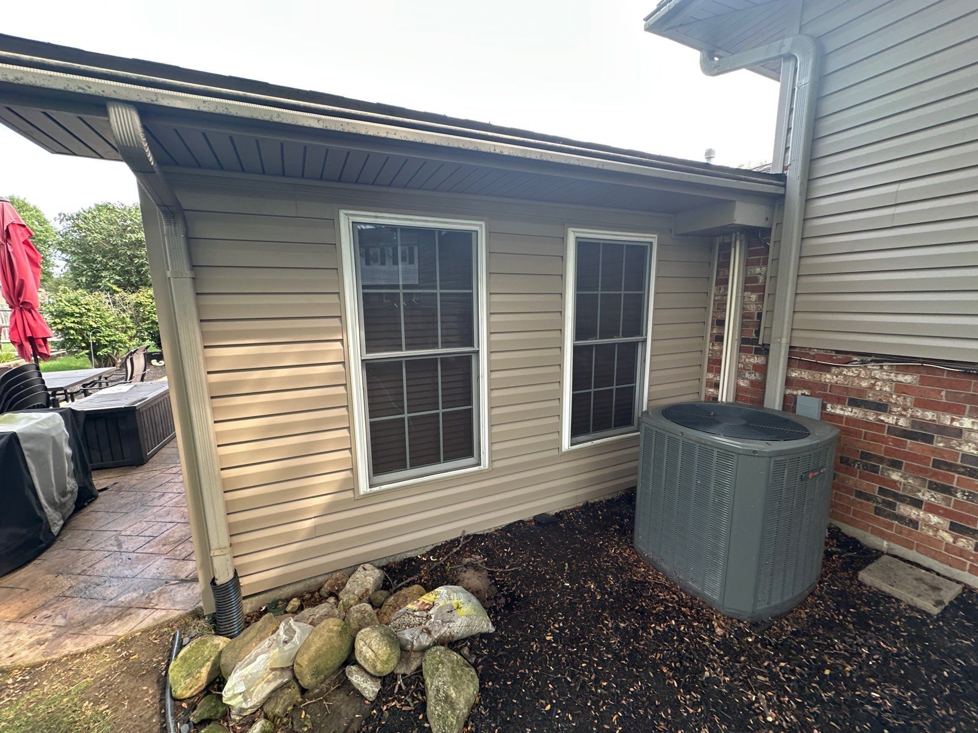 New siding at the corner beside the air conditioner, Beavercreek, Ohio.