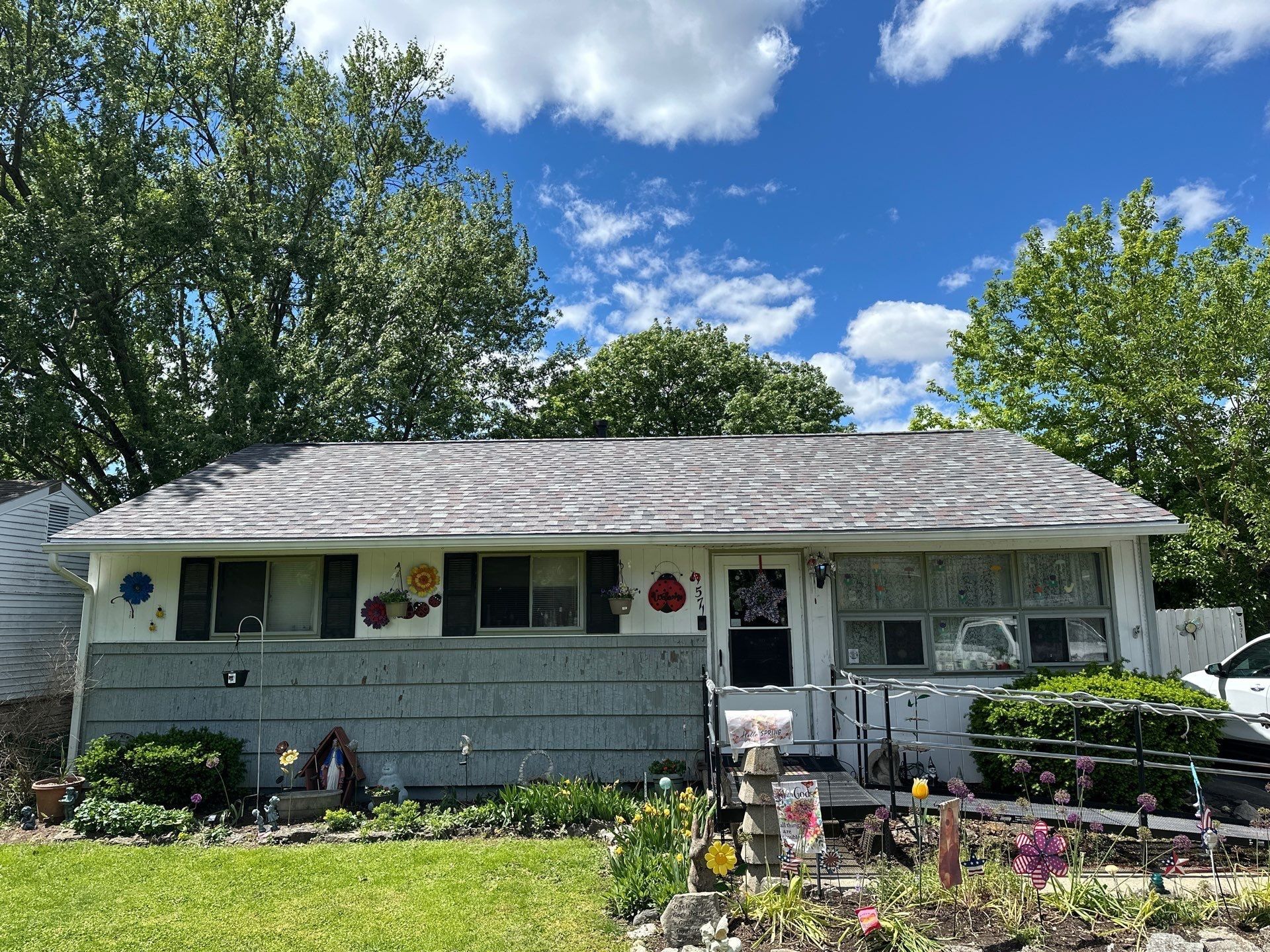 A Dayton ranch under a finished shingle roof, photographed from the front lawn on a clear day.