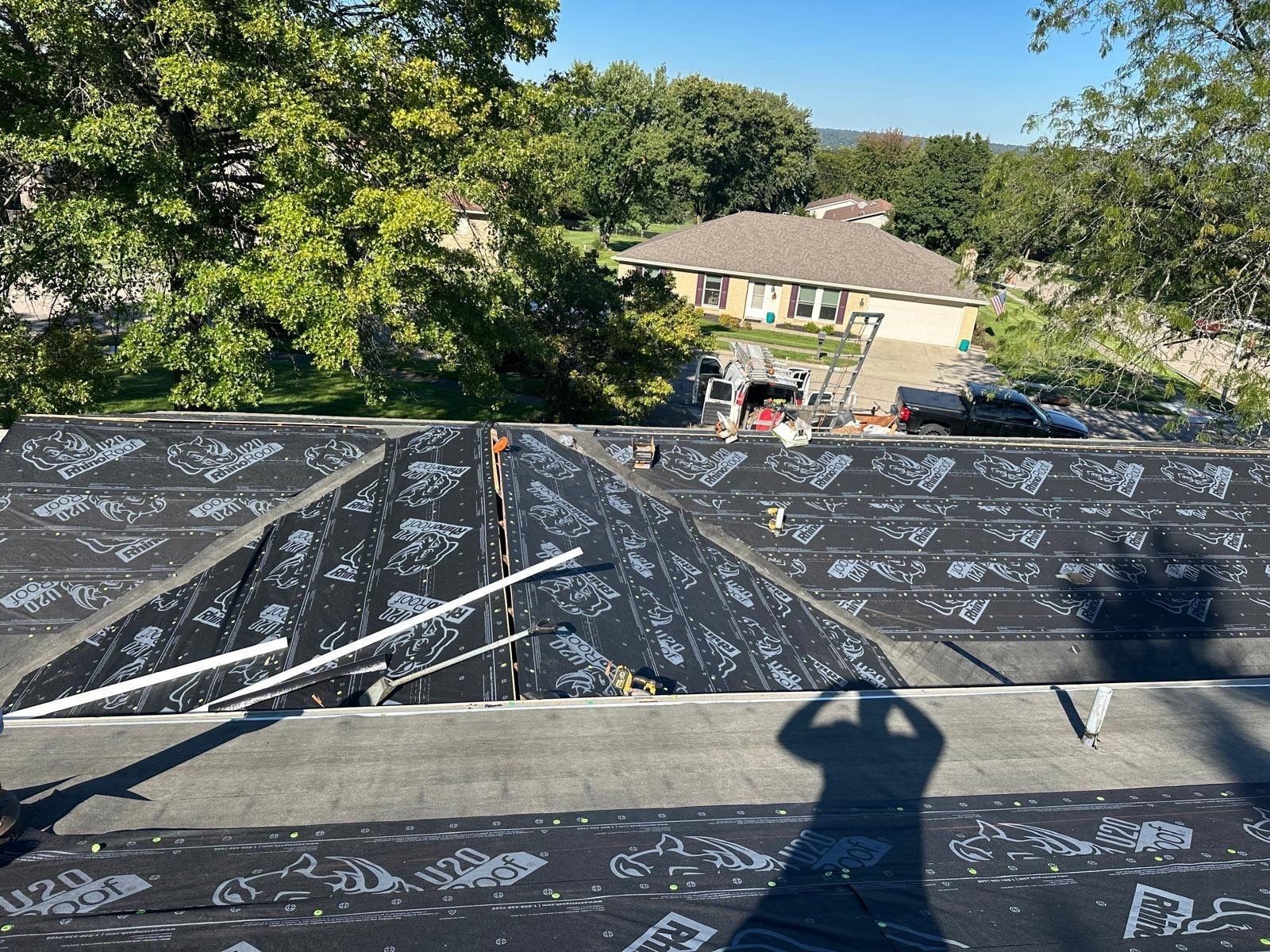 Underlayment over the hips of the lower roof, seen from the upper roof, West Carrollton, Ohio.