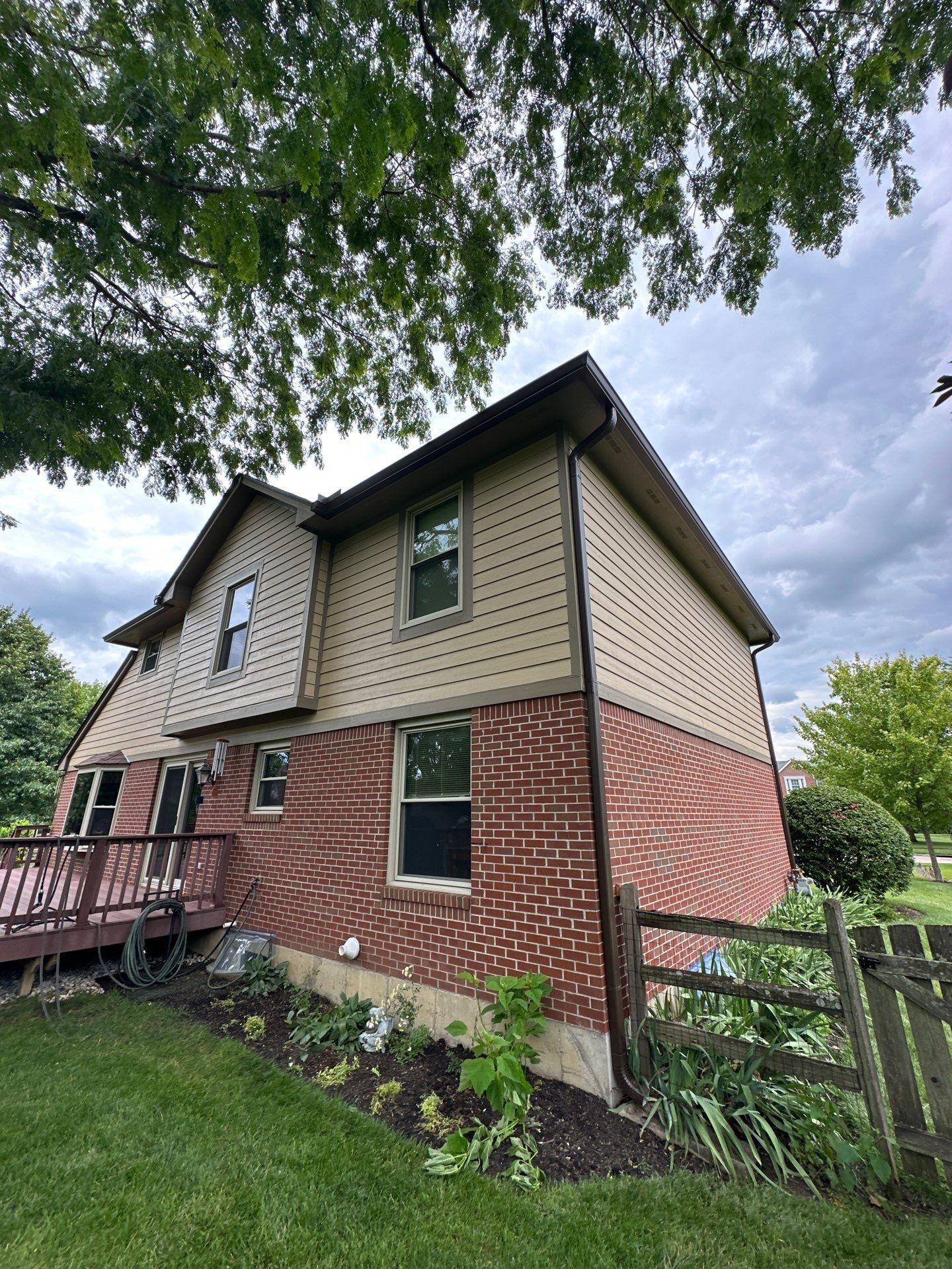 New gutters and downspout on the back corner of the house, Beavercreek, Ohio.