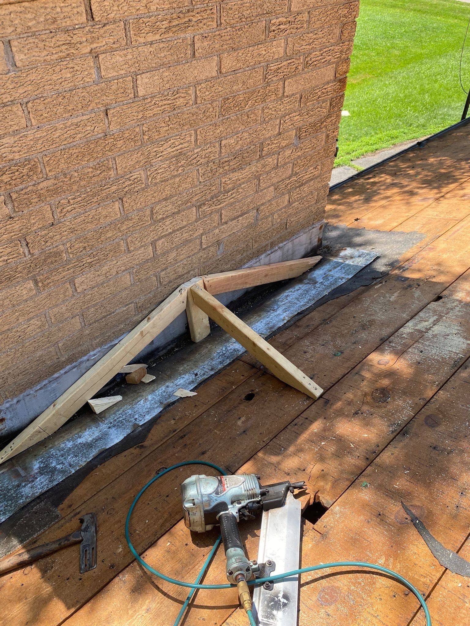 Wood framing for the new cricket built behind the chimney, Beavercreek, Ohio.