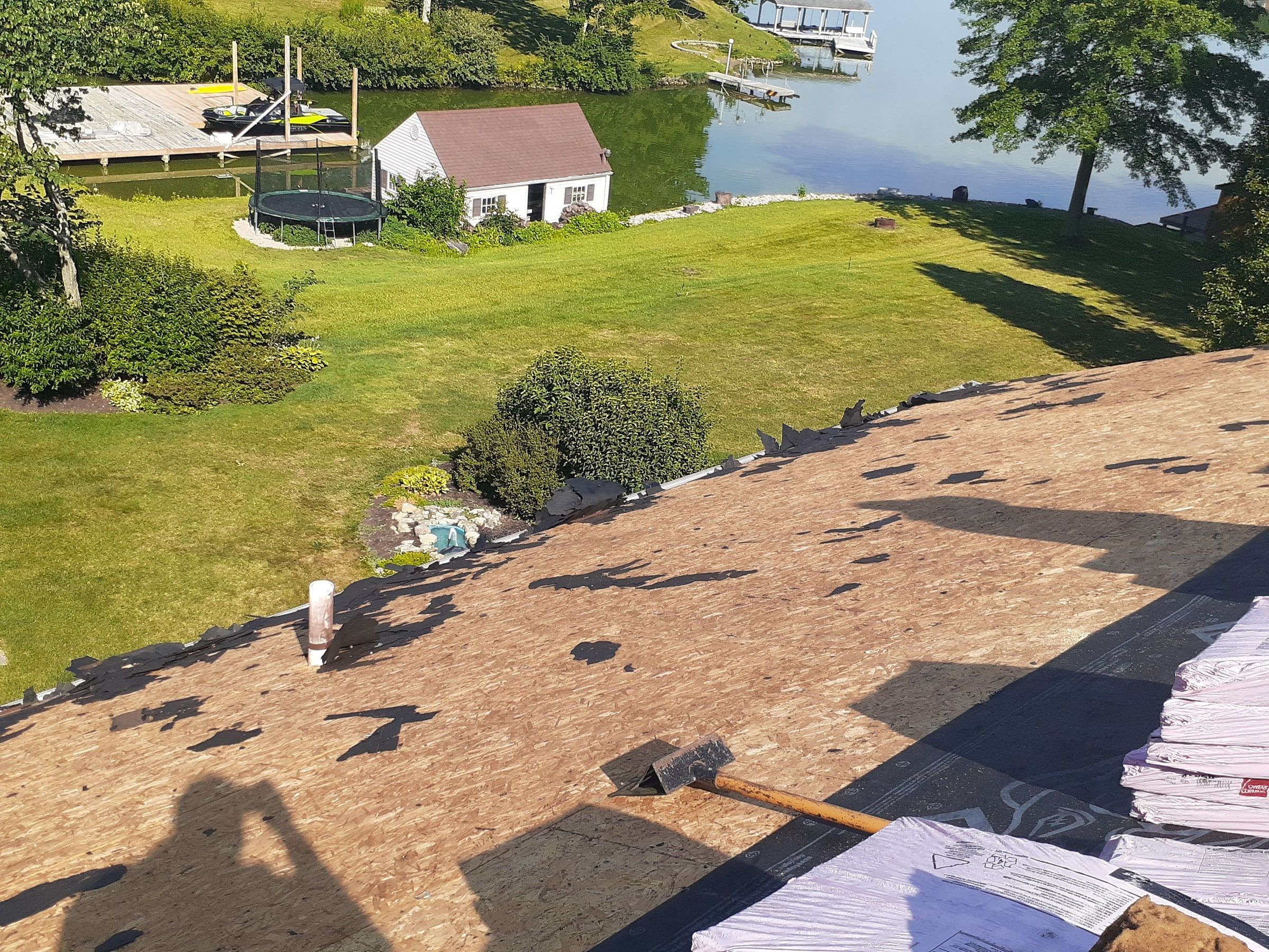 Stripped back slope over the lake yard with the original deck exposed, Jamestown, Ohio.