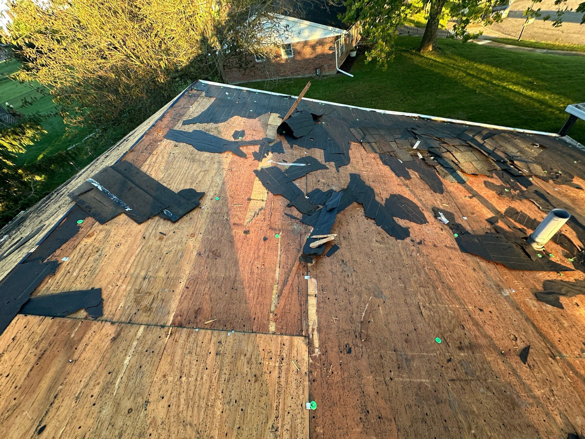 The old roof torn off down to the deck at the back of the house, West Carrollton, Ohio.