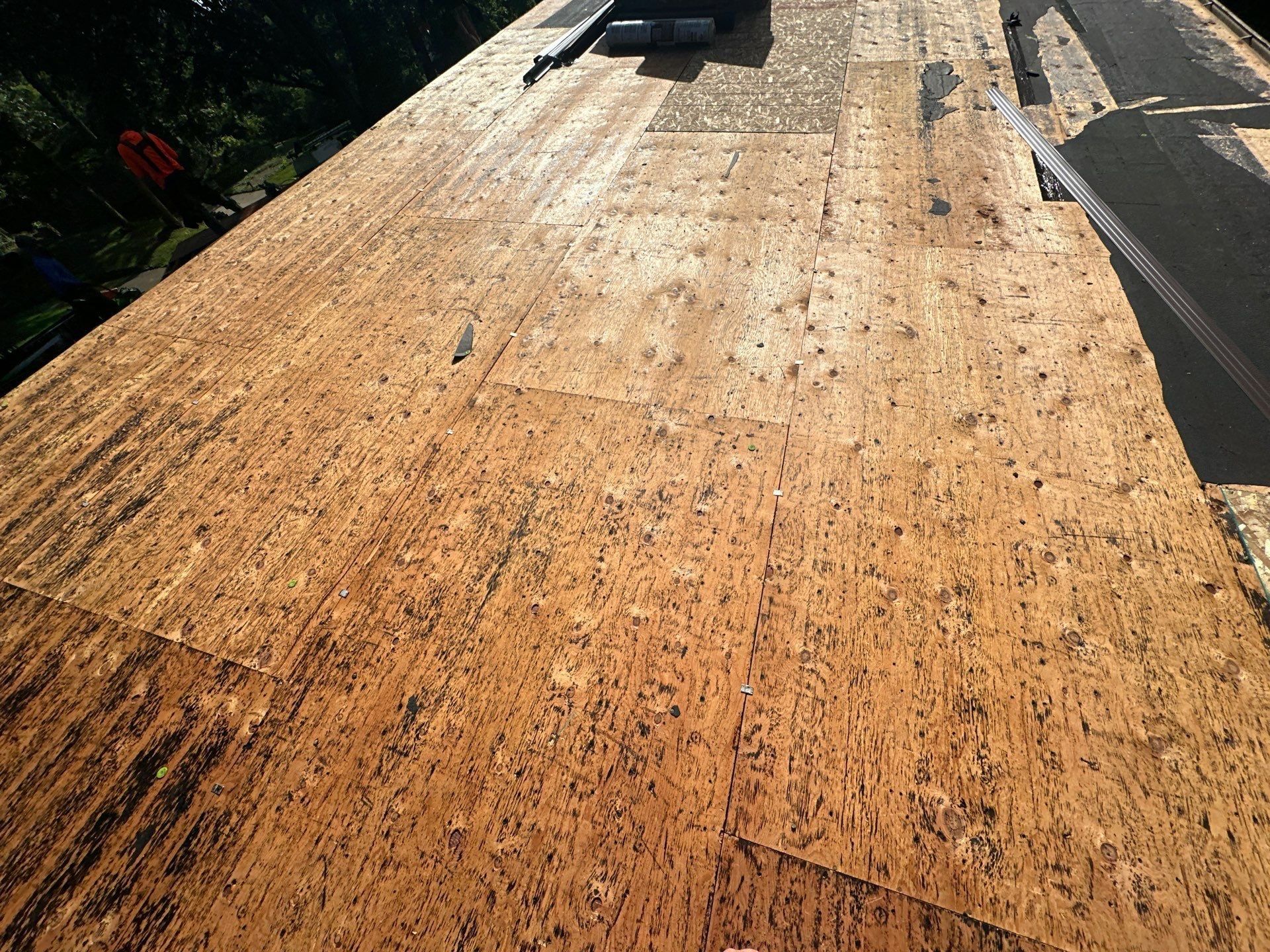 Stripped deck and the last old shingles