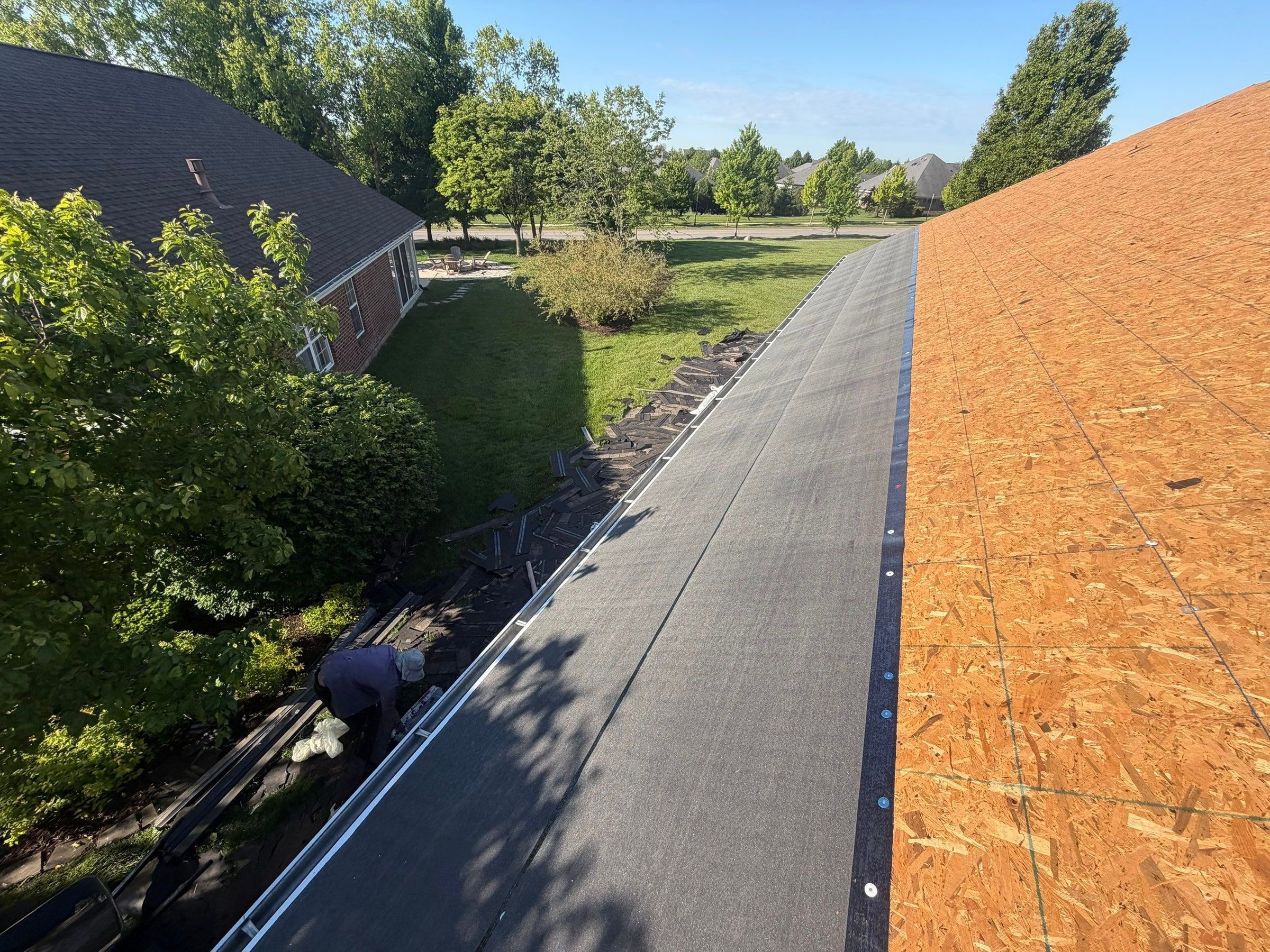 Underlayment on one slope, bare deck beyond