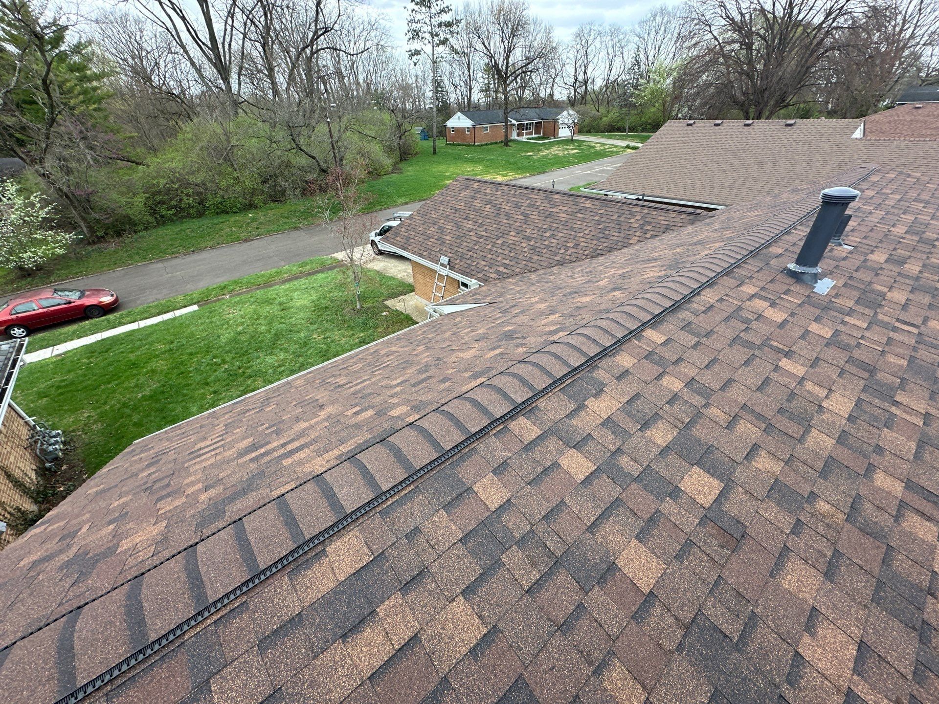 The finished ridge vent past a roof vent, Dayton, Ohio.