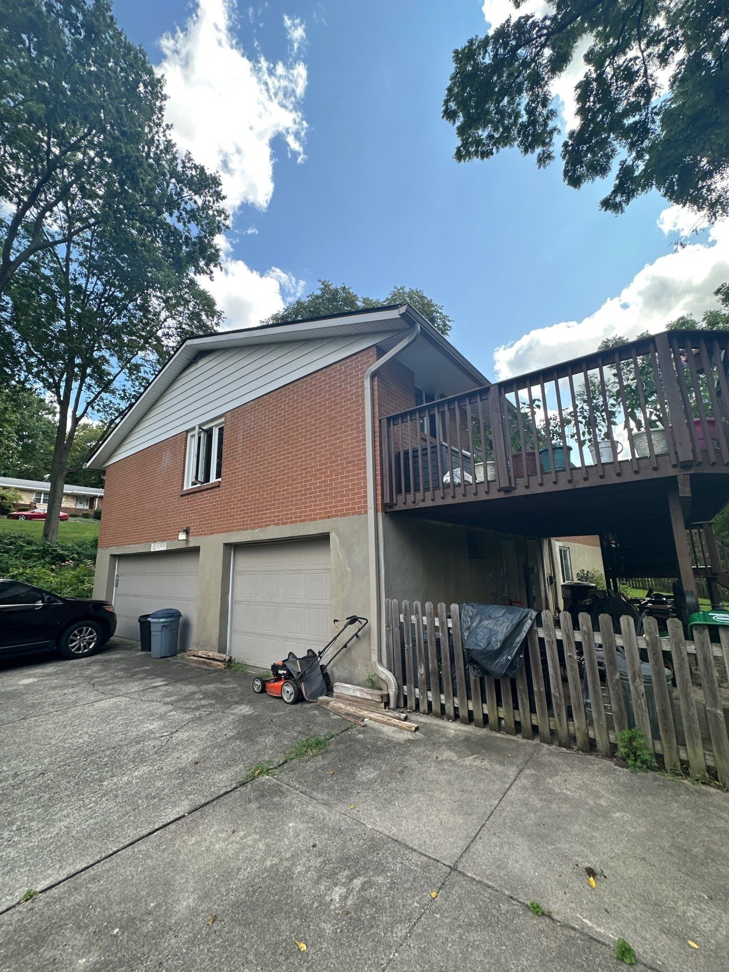 New gutter and downspout over the garage doors, Beavercreek, Ohio.