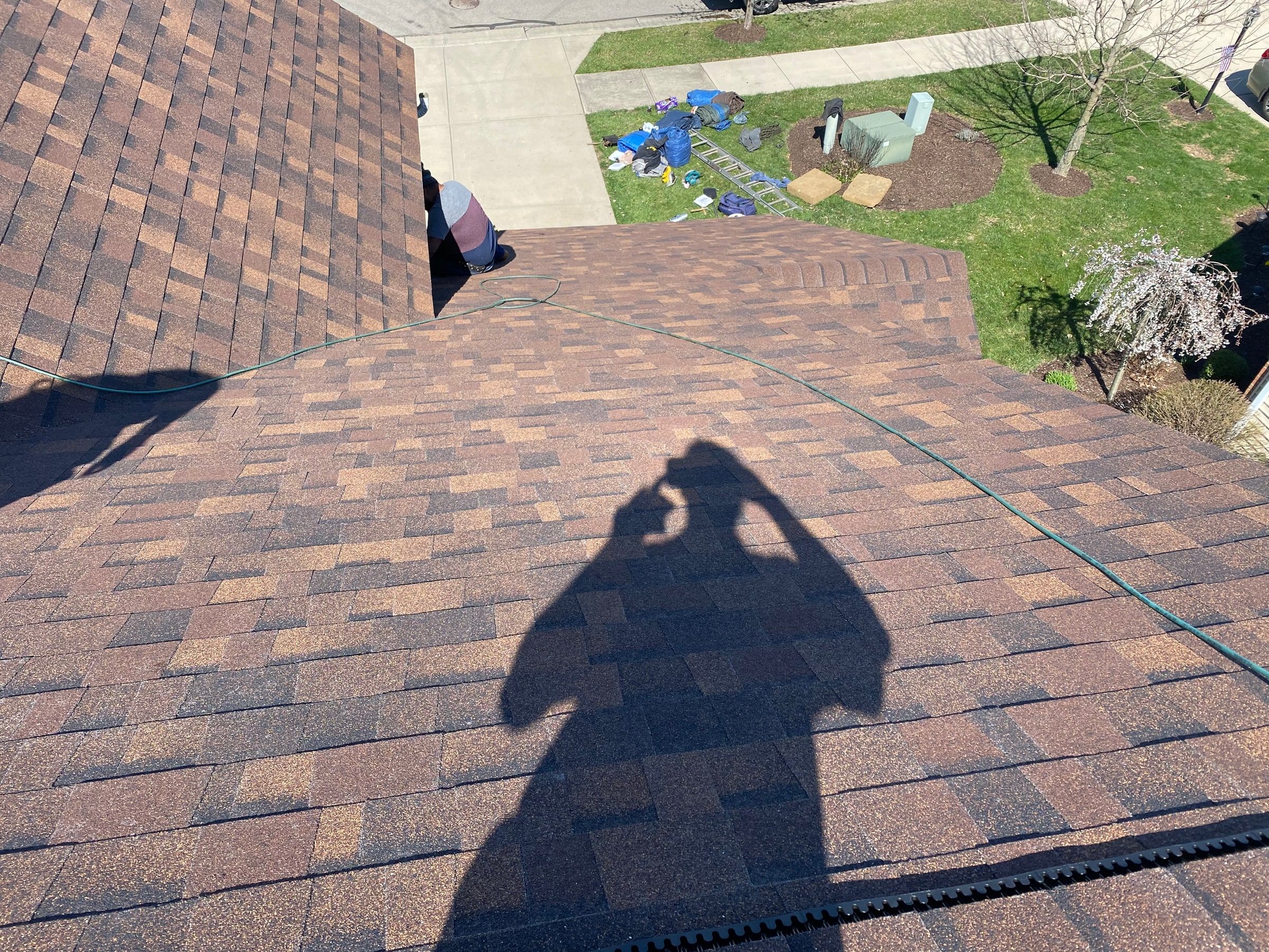 The finished lower roof where two planes meet, with the front yard below, Xenia, Ohio.