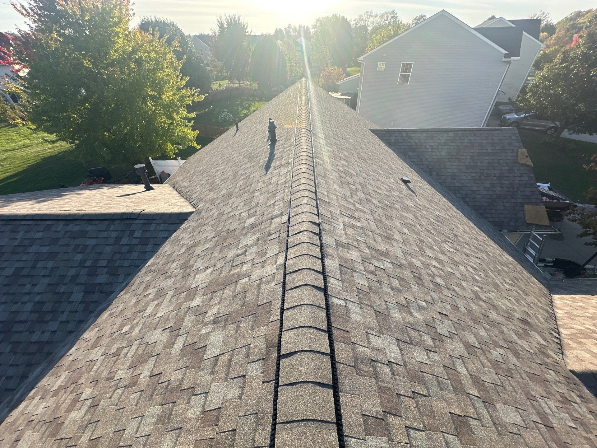 The new ridge cap down the main roof in the afternoon sun, Beavercreek, Ohio.
