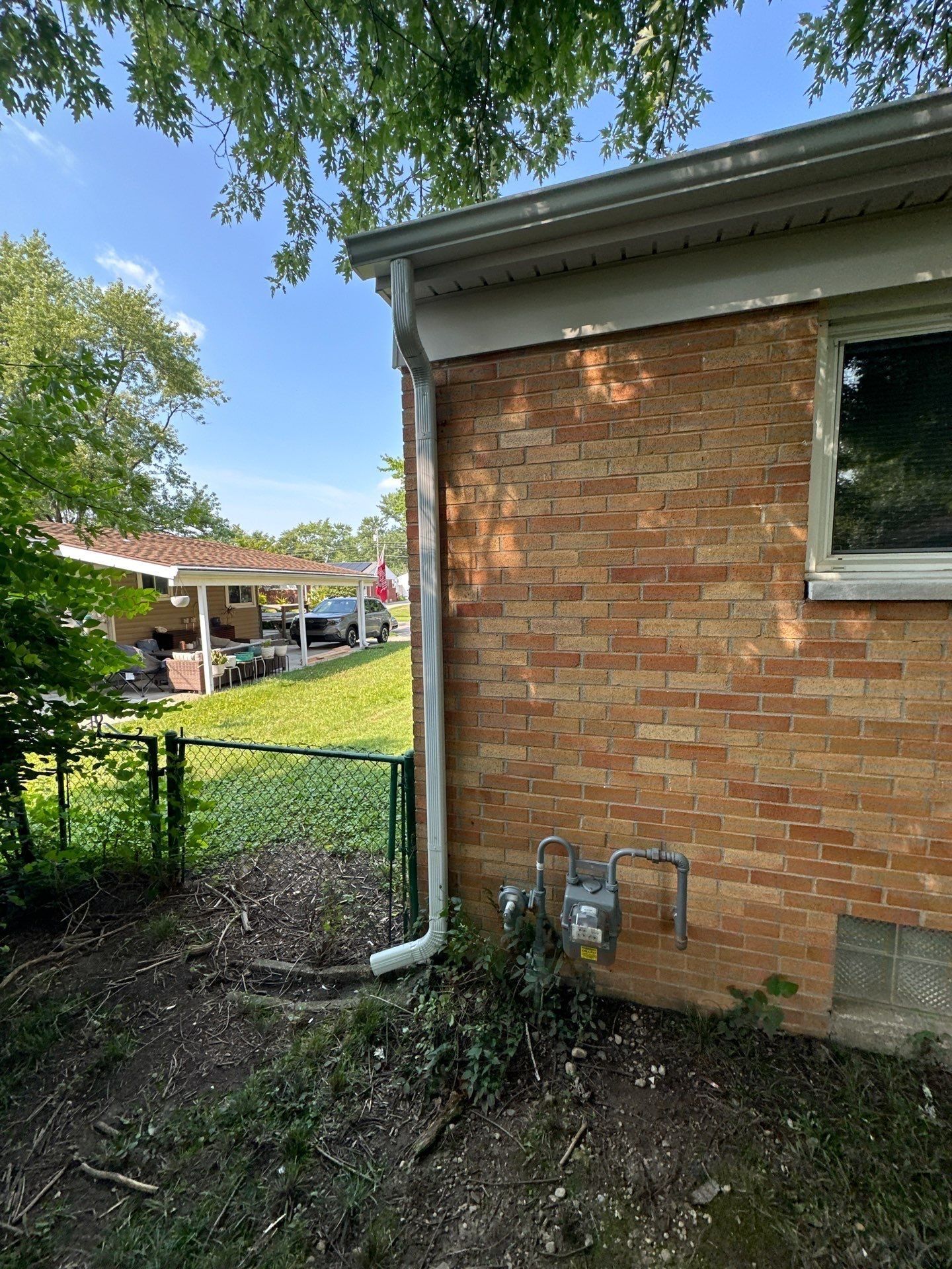 End wall gutter run and downspout