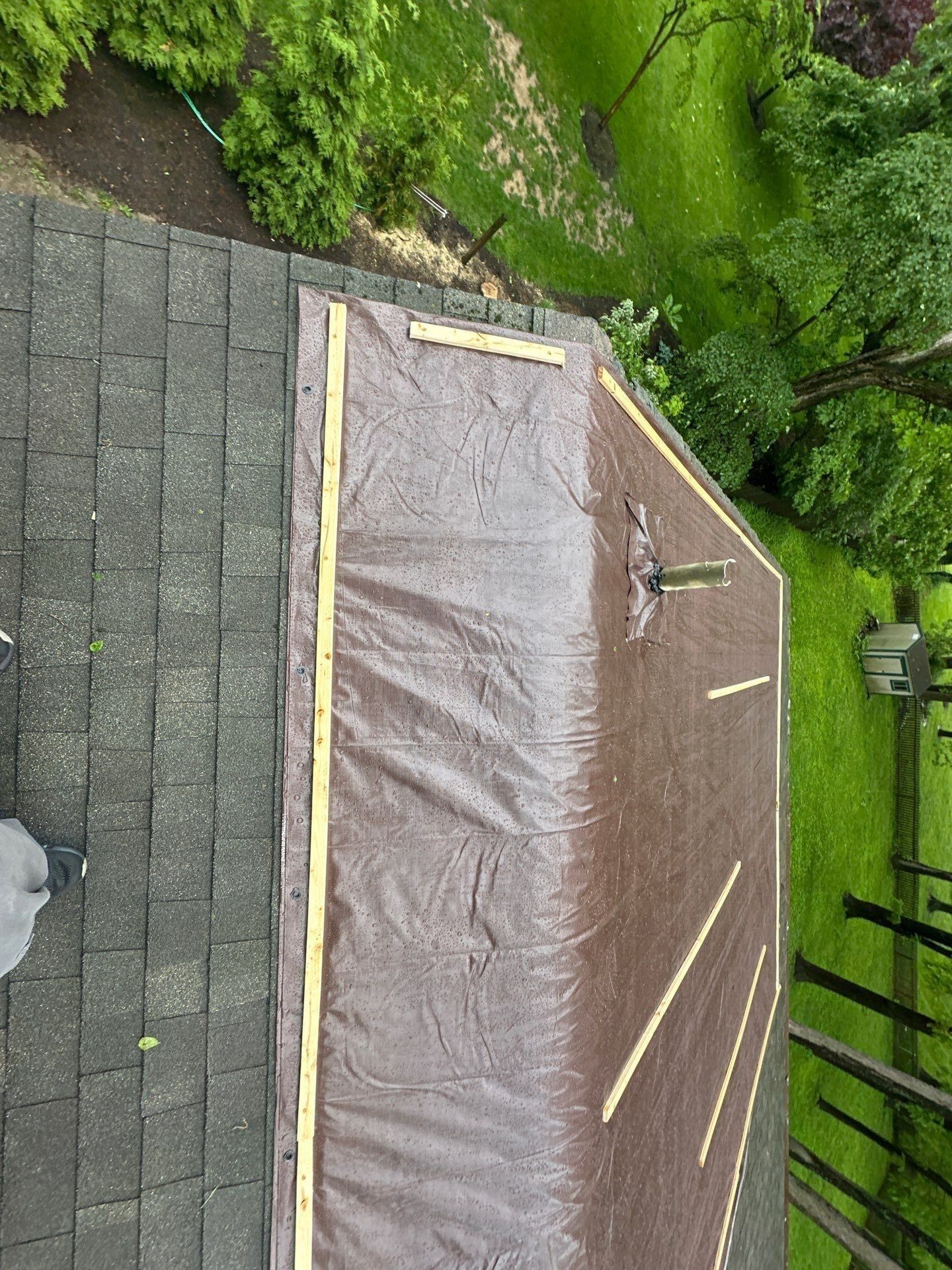 Brown tarp battened with timber strips