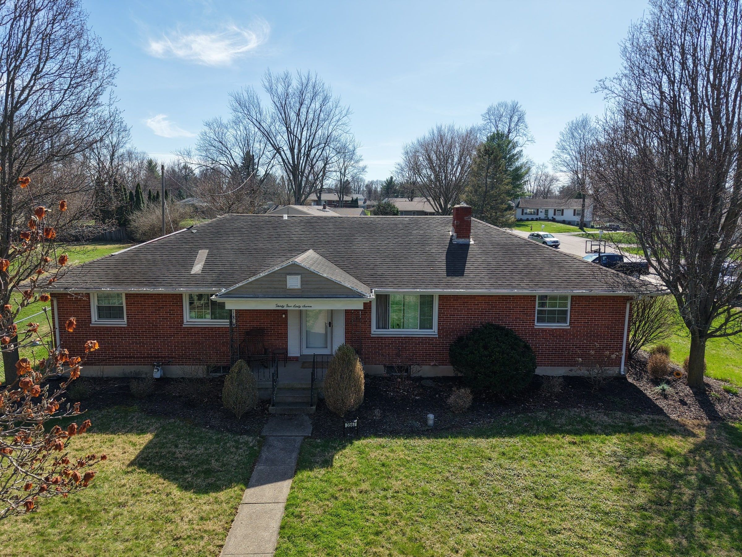 Brick ranch front from the air