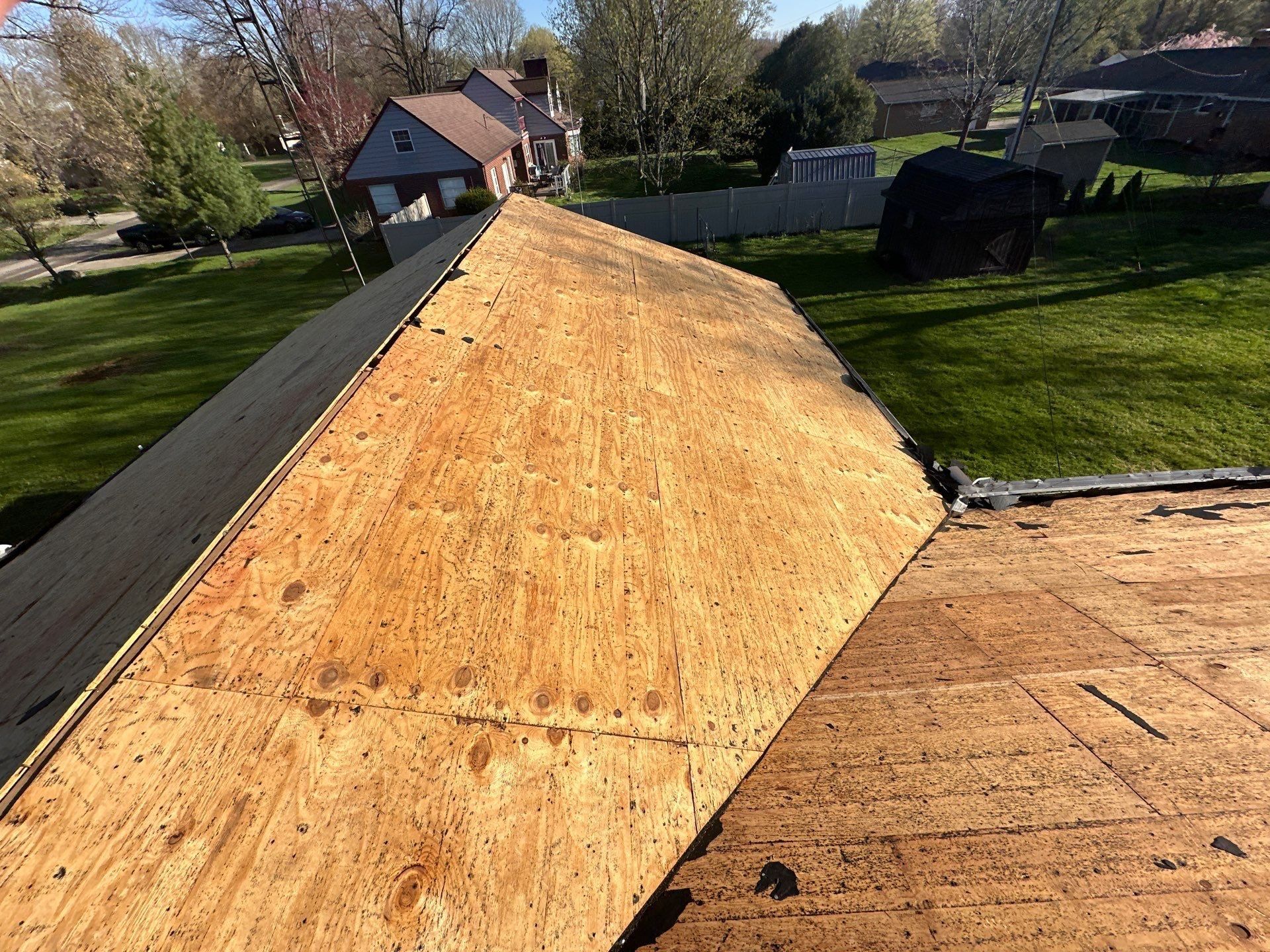 Clean plywood deck on a back roof slope after the old roof came off, Beavercreek, Ohio.