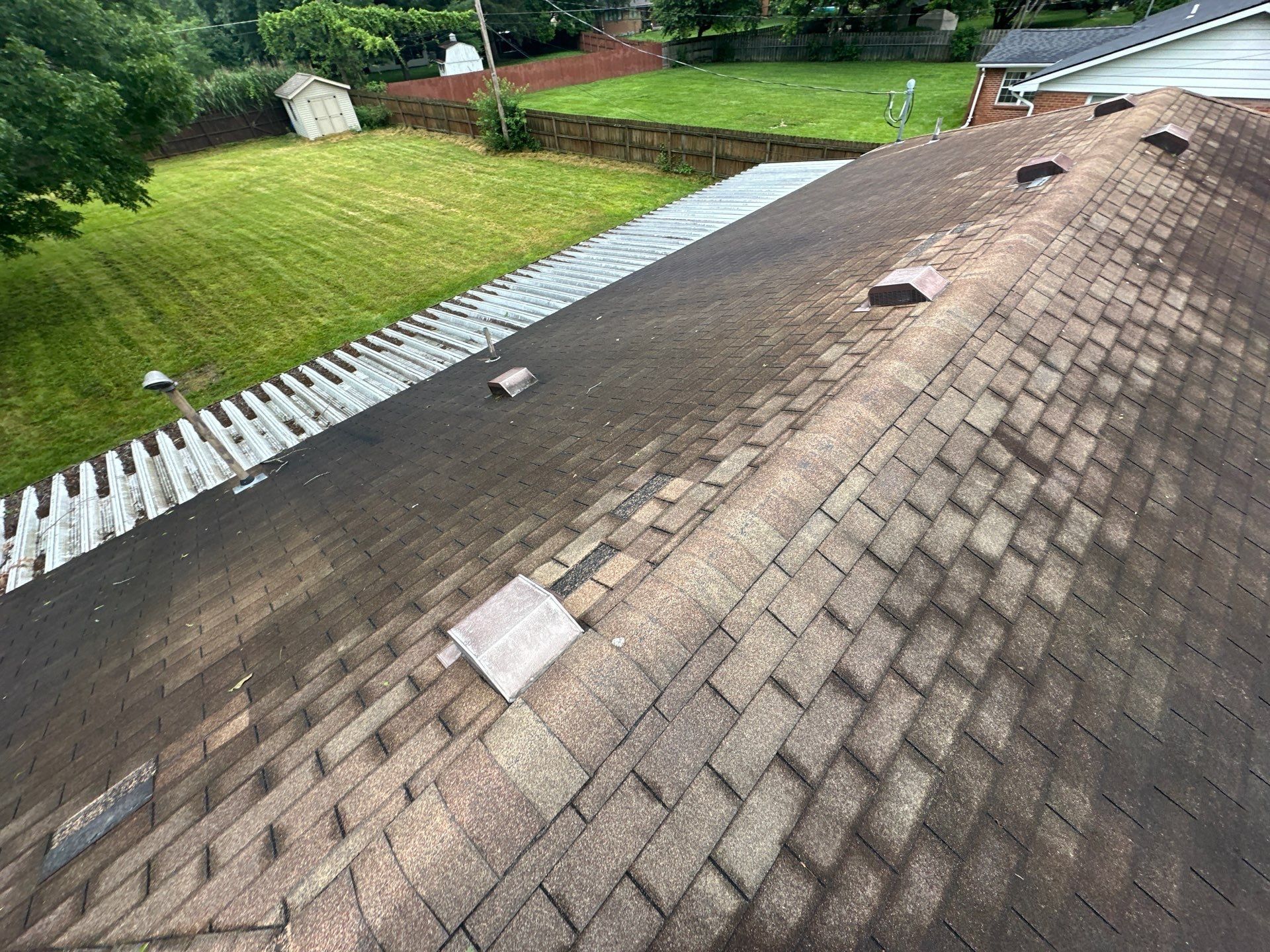 Long ridge line of the old roof lined with box vents, Beavercreek, Ohio.