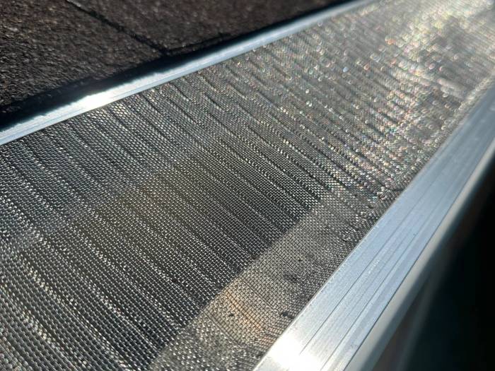 Sunlight on the fine mesh of a gutter guard, close up, Kettering, Ohio.