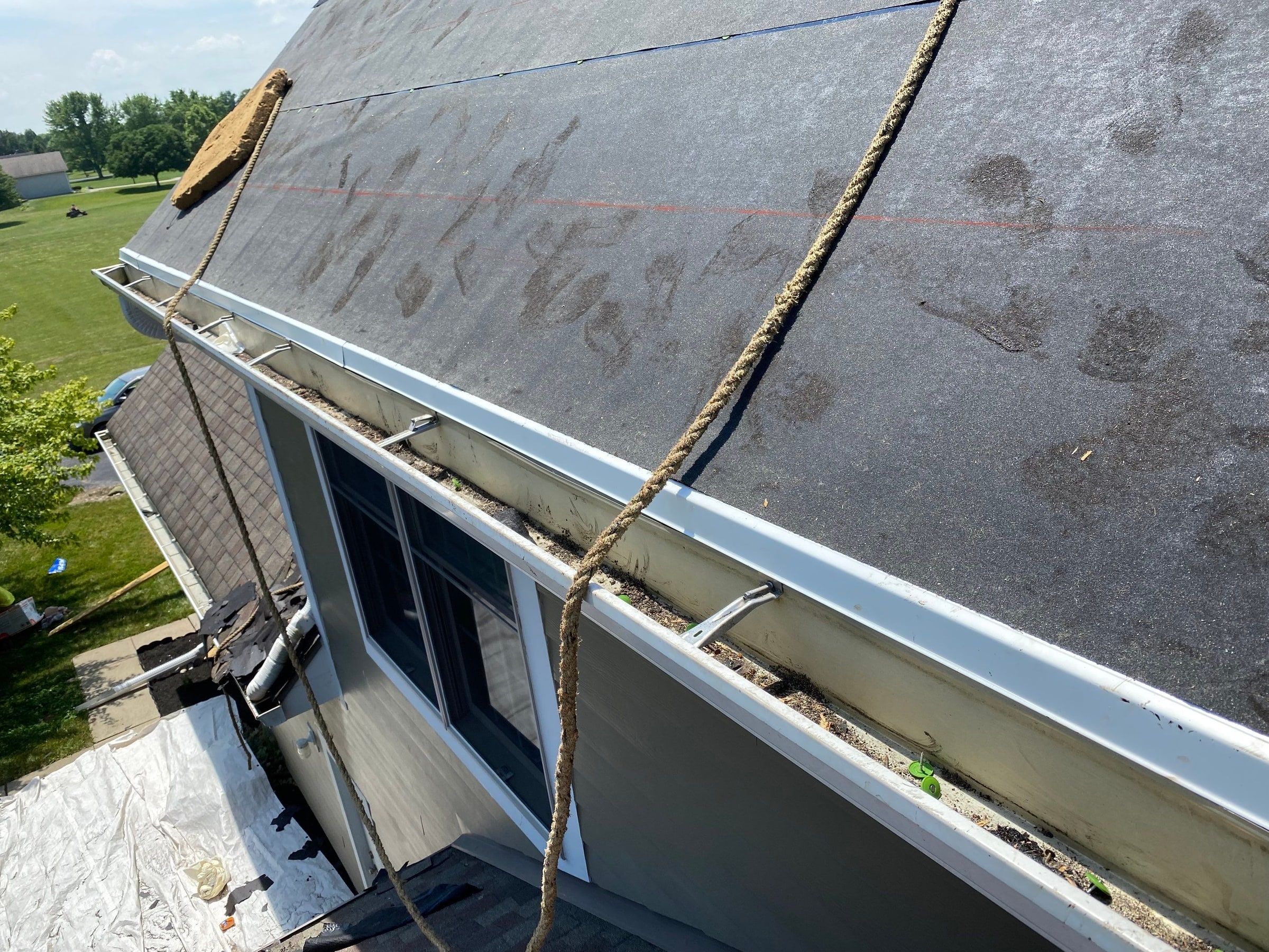 Underlayment covering the lower roof above the gutter line, Yellow Springs, Ohio.
