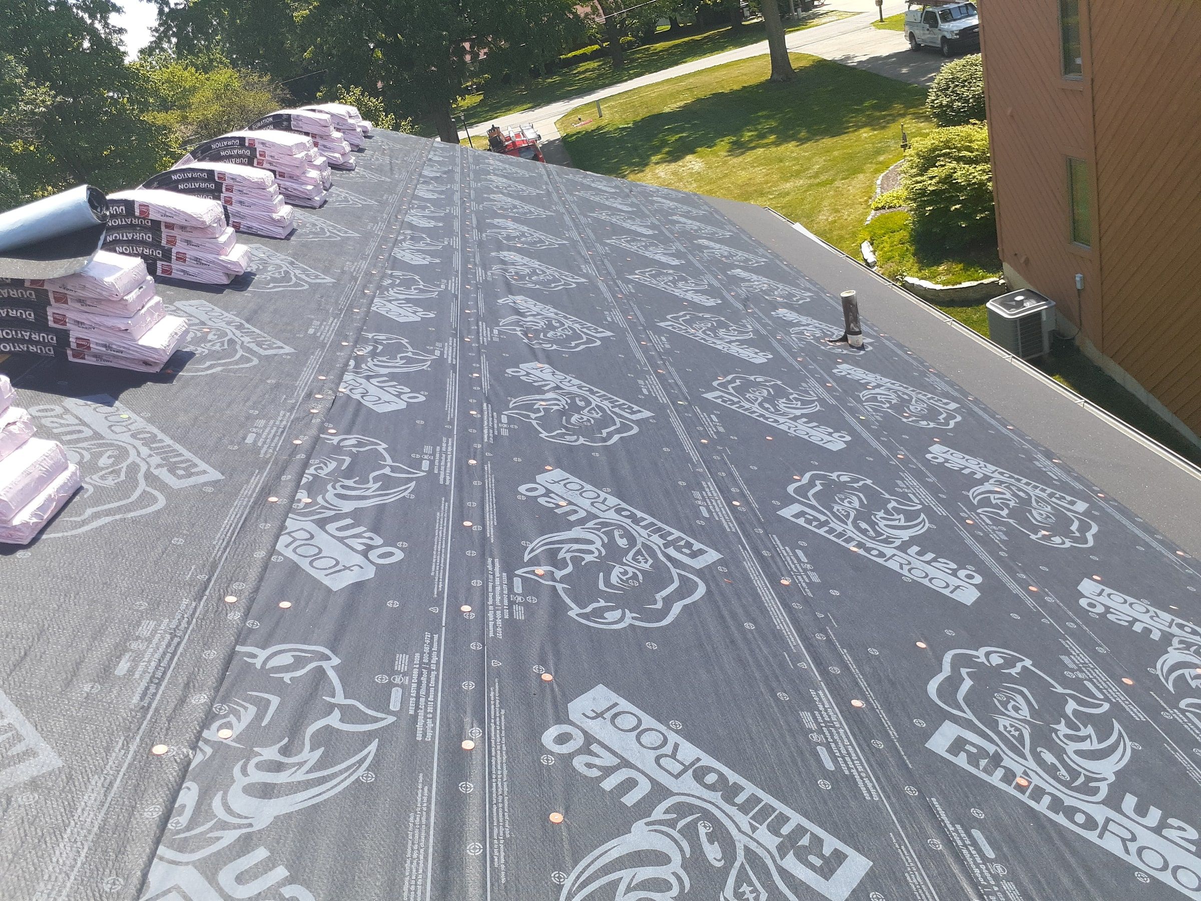 Full slope wrapped in RhinoRoof U20 underlayment looking toward the street, Jamestown, Ohio.