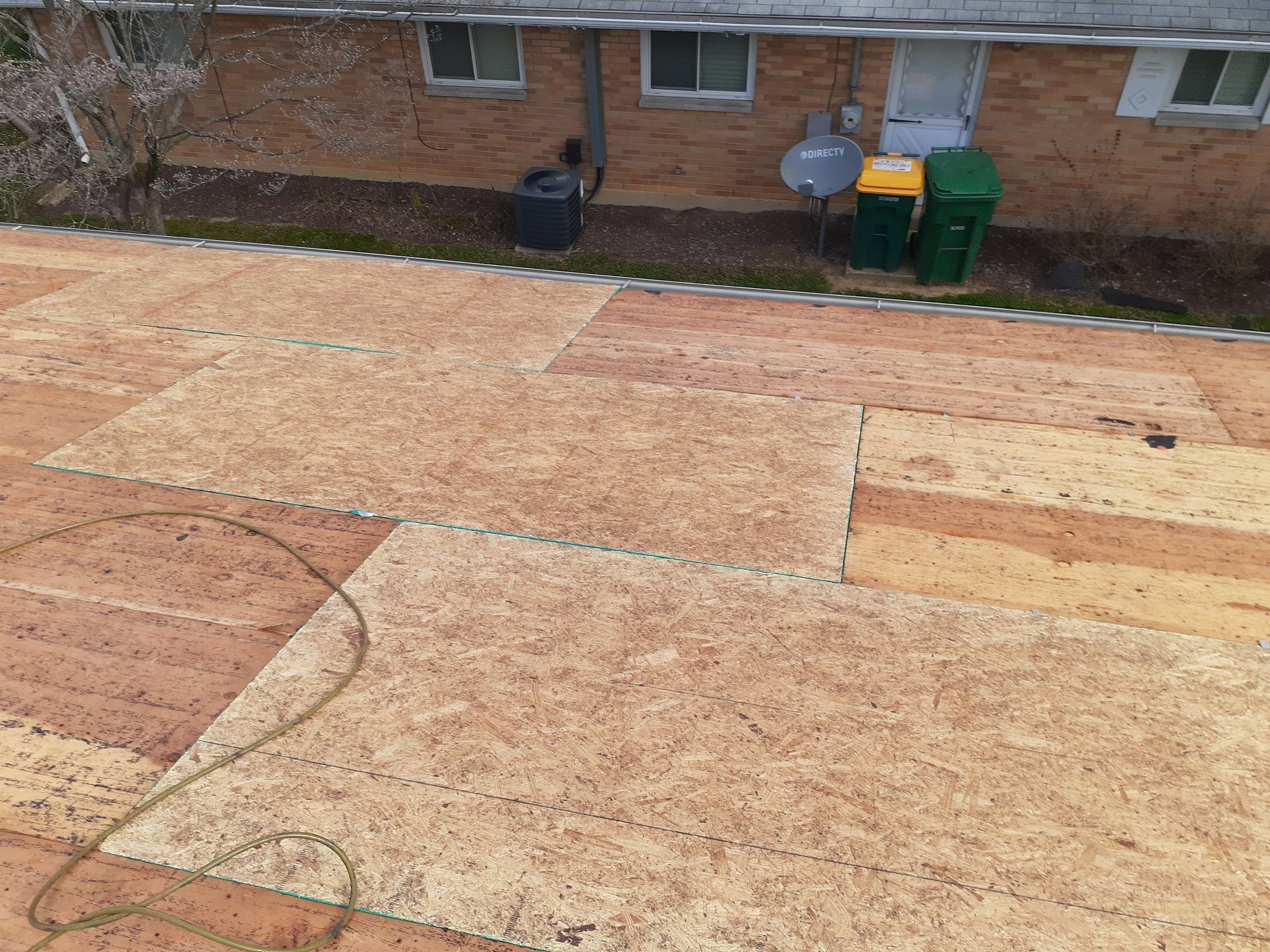 New OSB sheets patched into the old deck above the back yard, Kettering, Ohio.