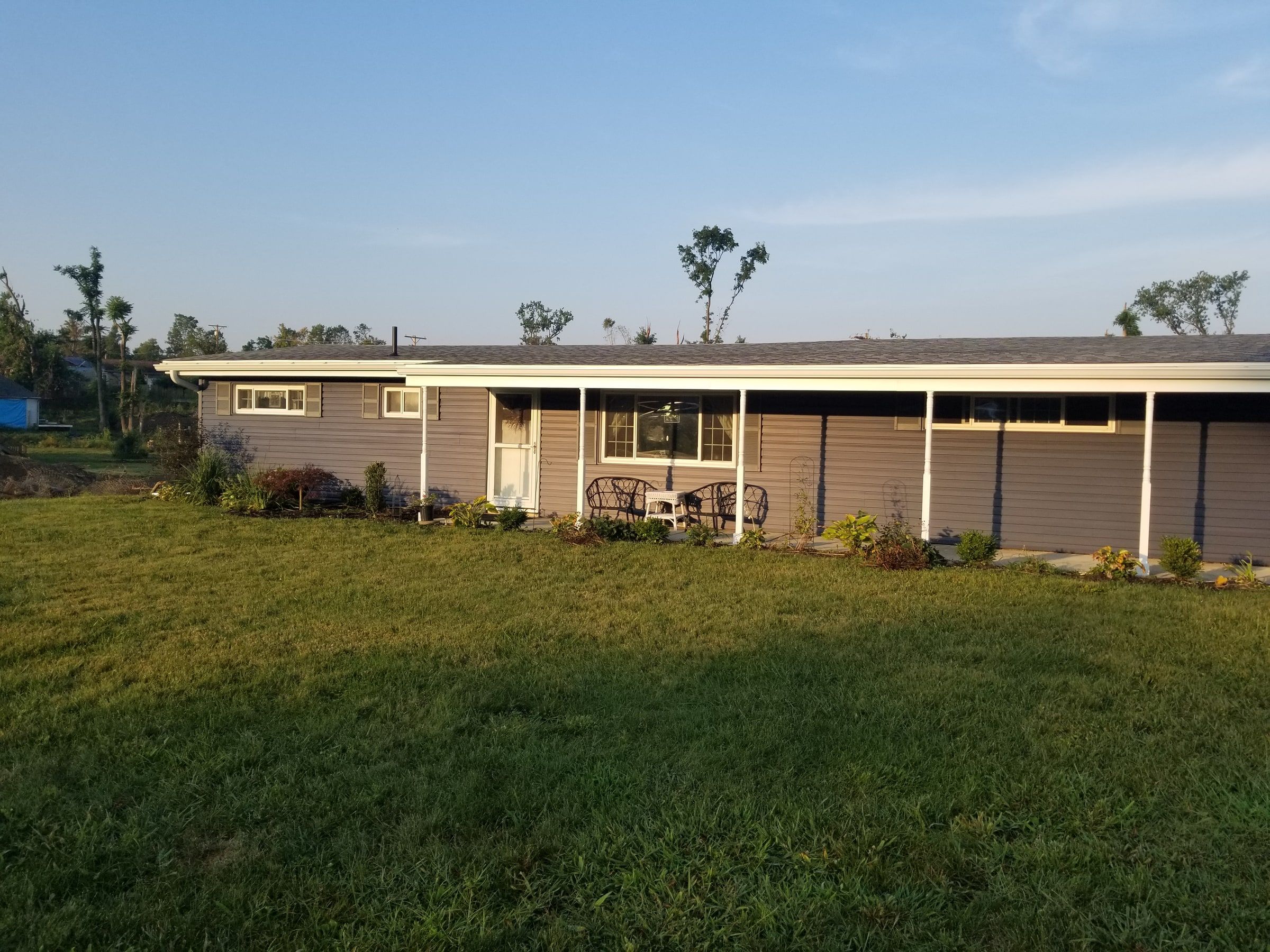 The long front of the house in new siding, seen across the lawn, Beavercreek, Ohio.