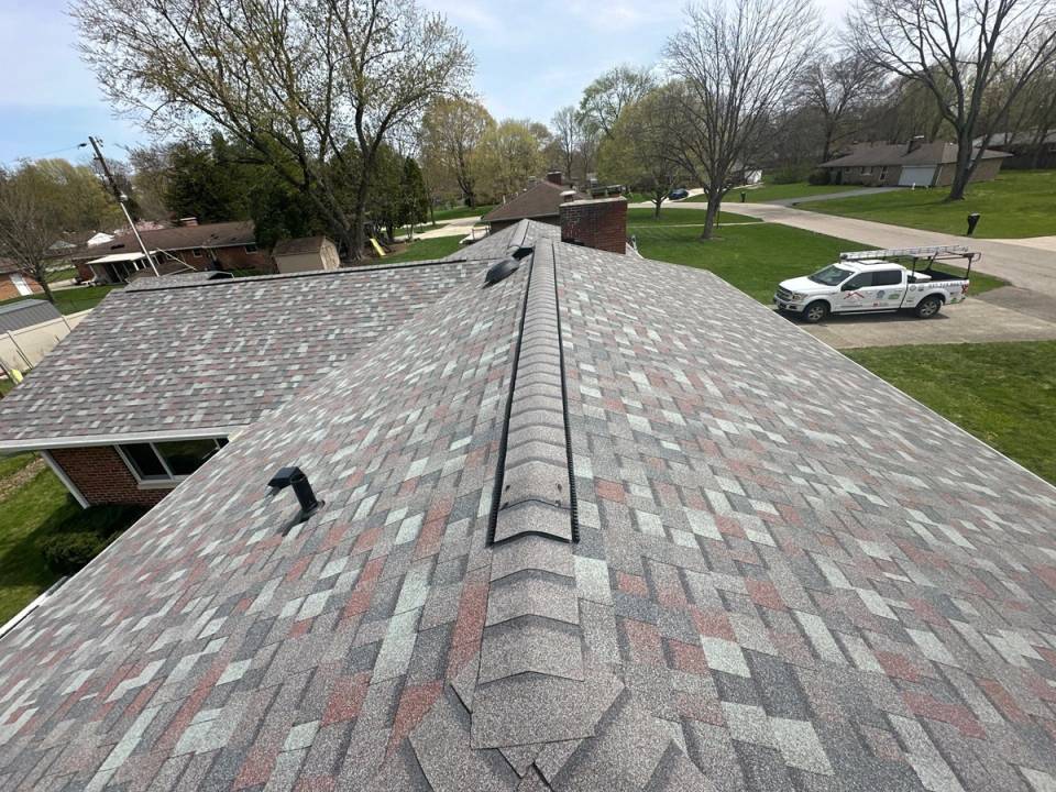 Finished roof with ridge vent and exhaust vents over the garage wing, Beavercreek, Ohio.