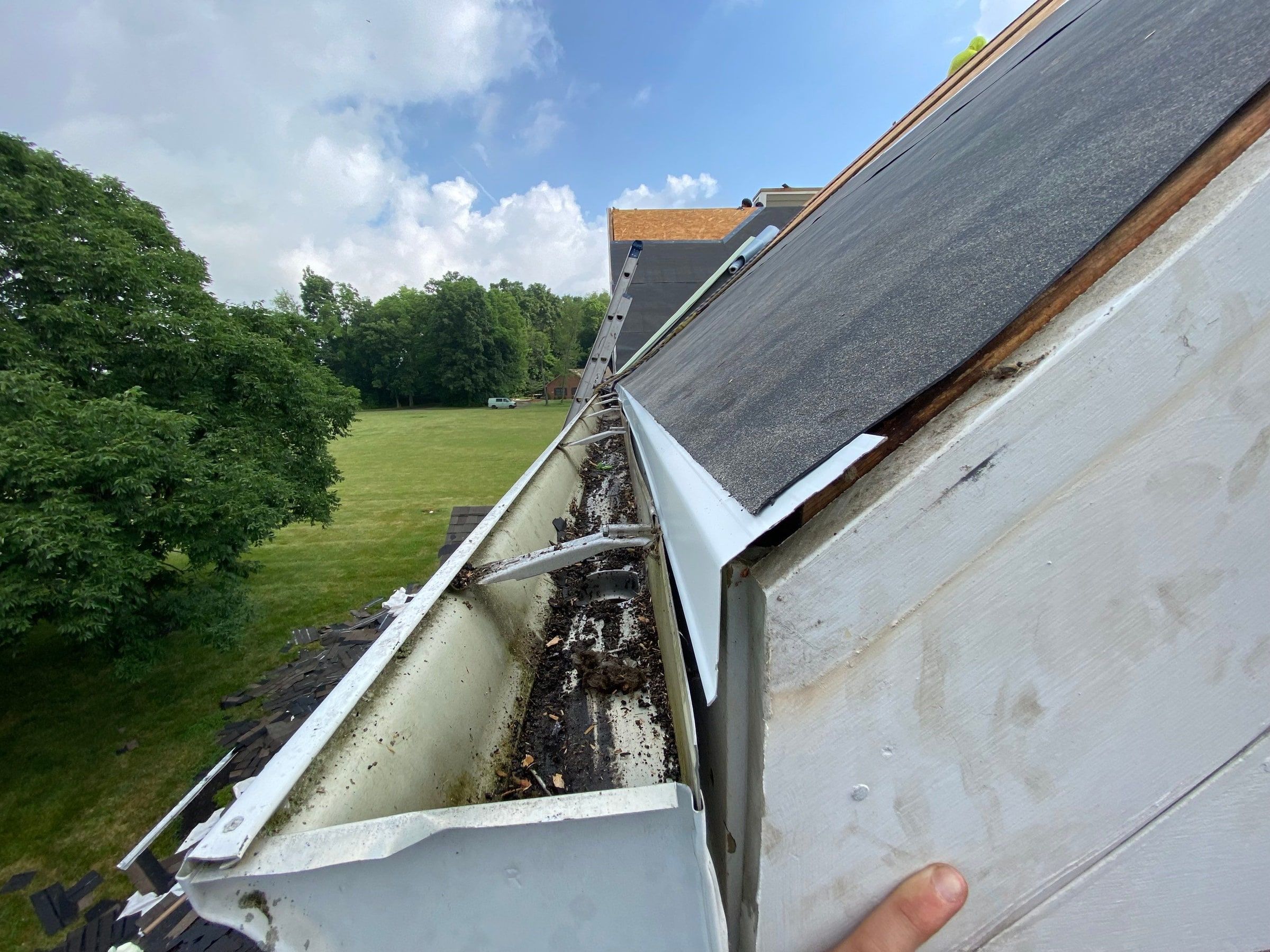 Underlayment and metal edge where the rake meets the gutter, Yellow Springs, Ohio.