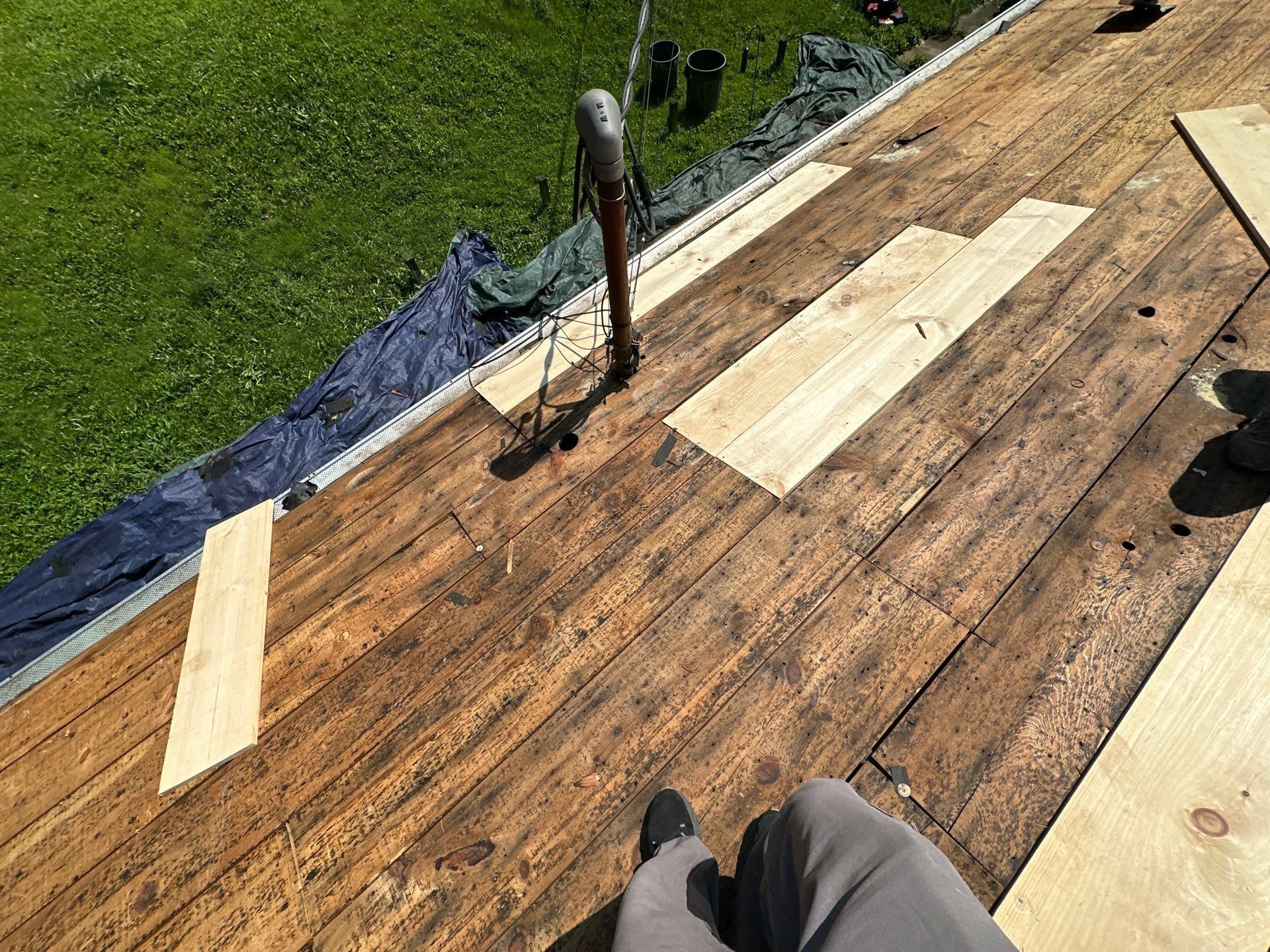 New pine boards patched into the deck near a vent pipe, Fairborn, Ohio.