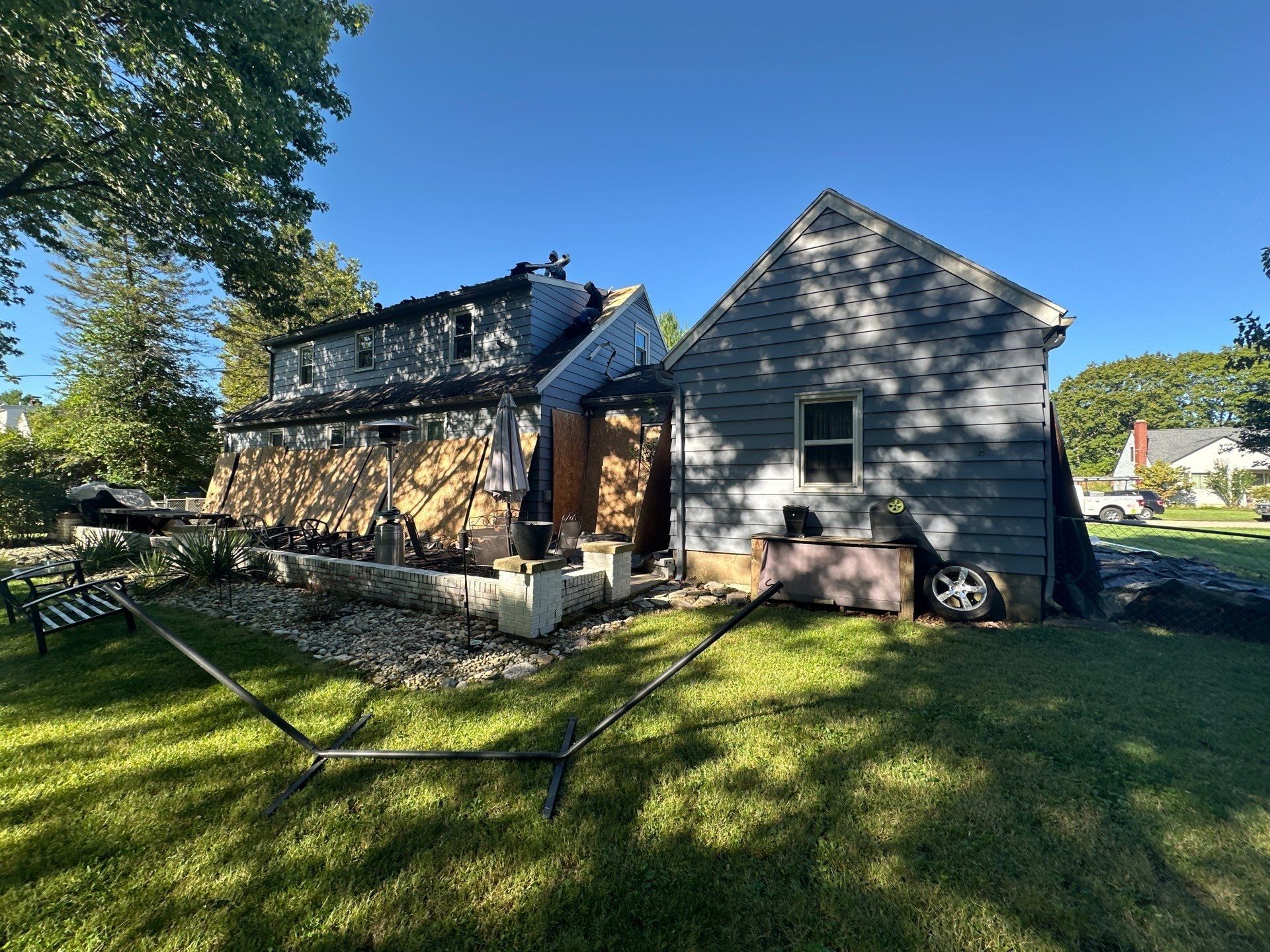 Plywood across the back of the house, with the garage beside it, Beavercreek, Ohio.