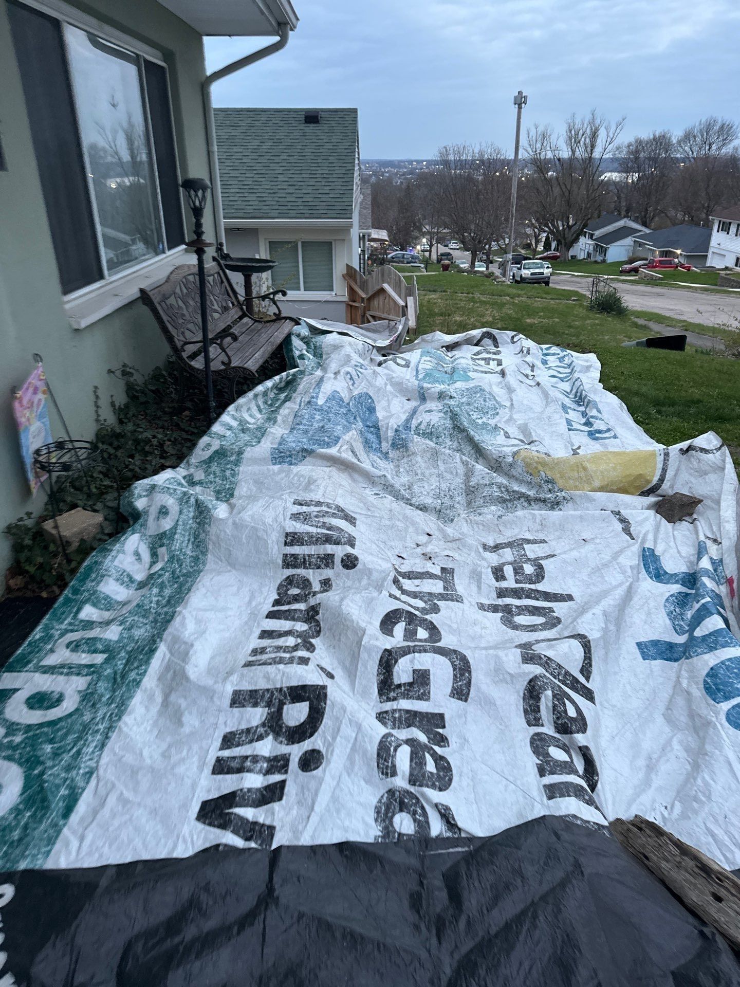 Tarps over the shrubs by the front porch, Dayton, Ohio.