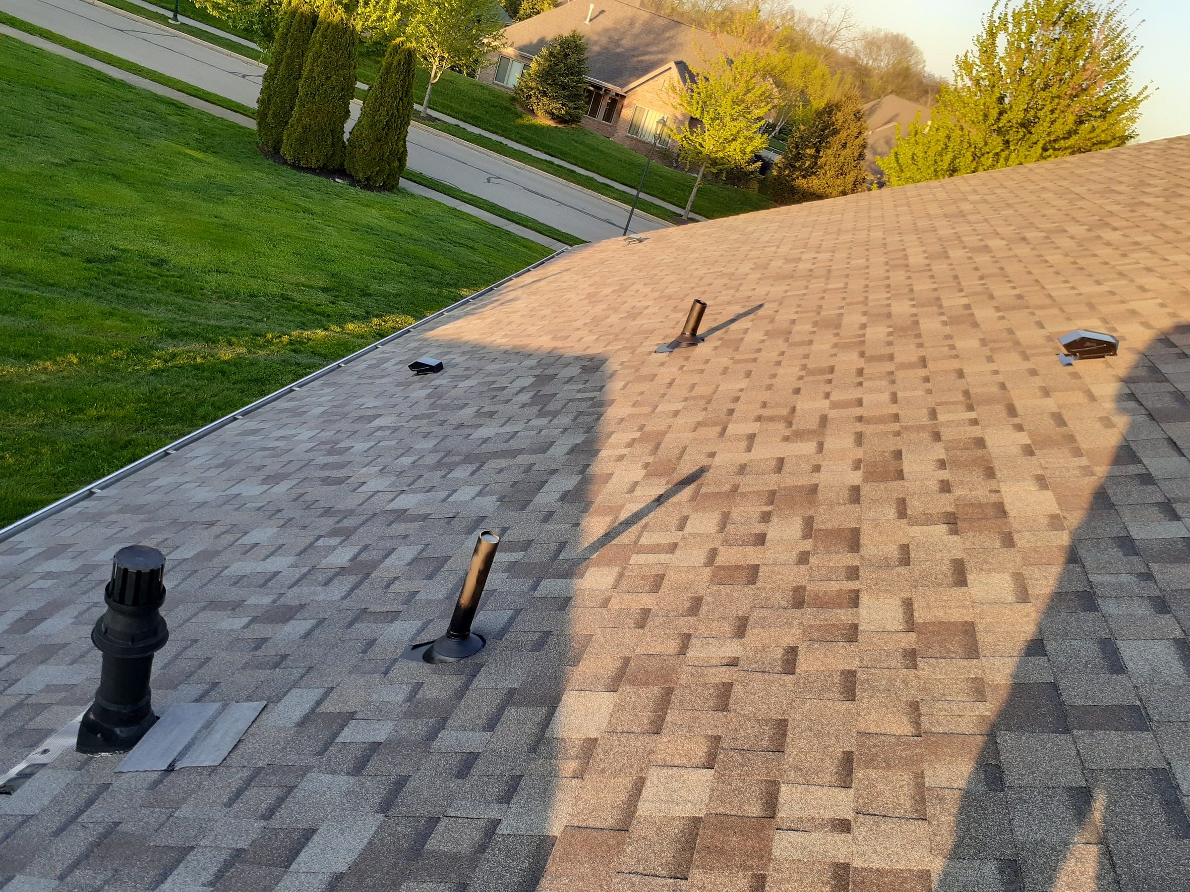 Roof with both plumbing vents reflashed