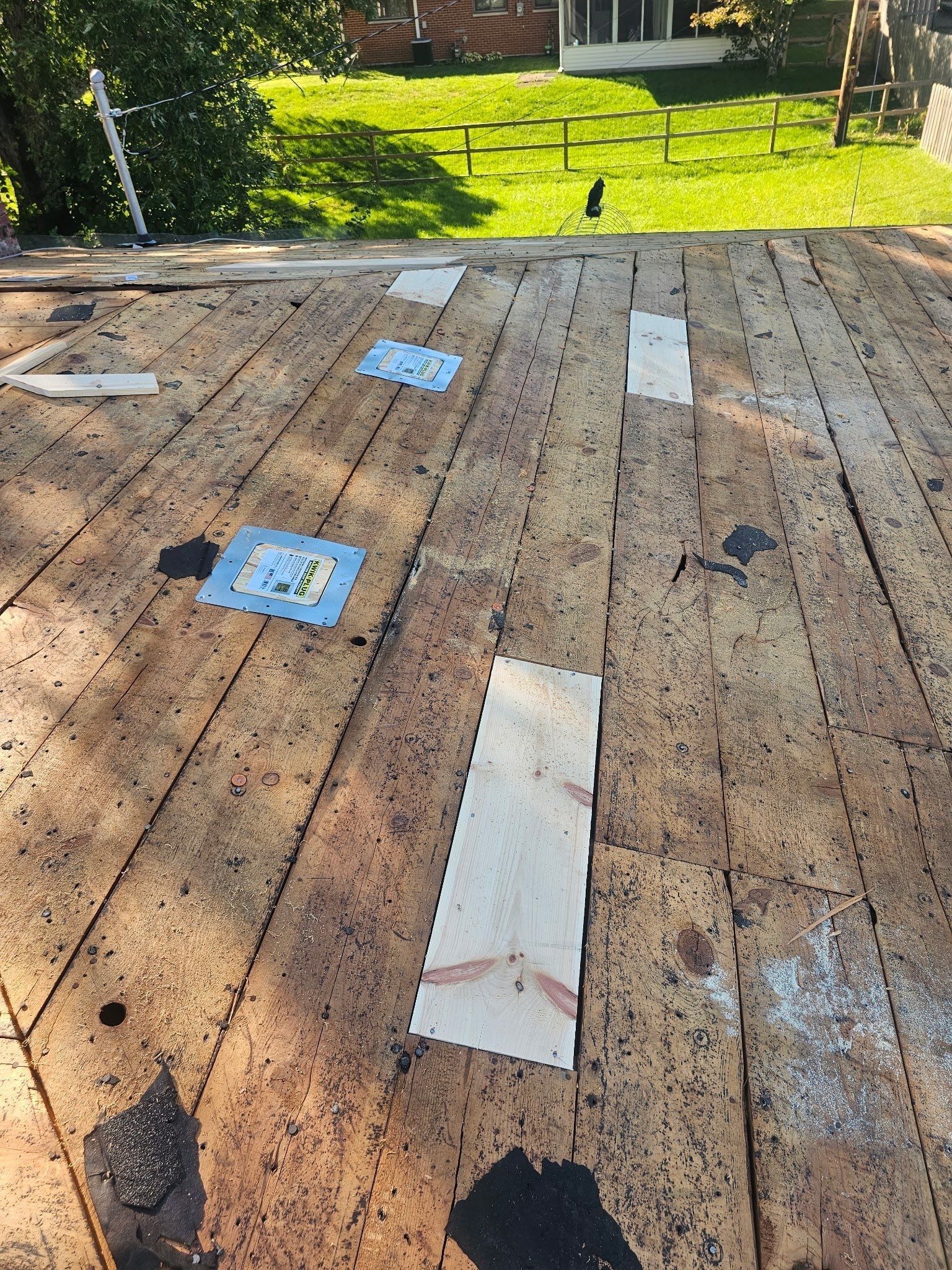New pine boards patched into the plank deck, Kettering, Ohio.