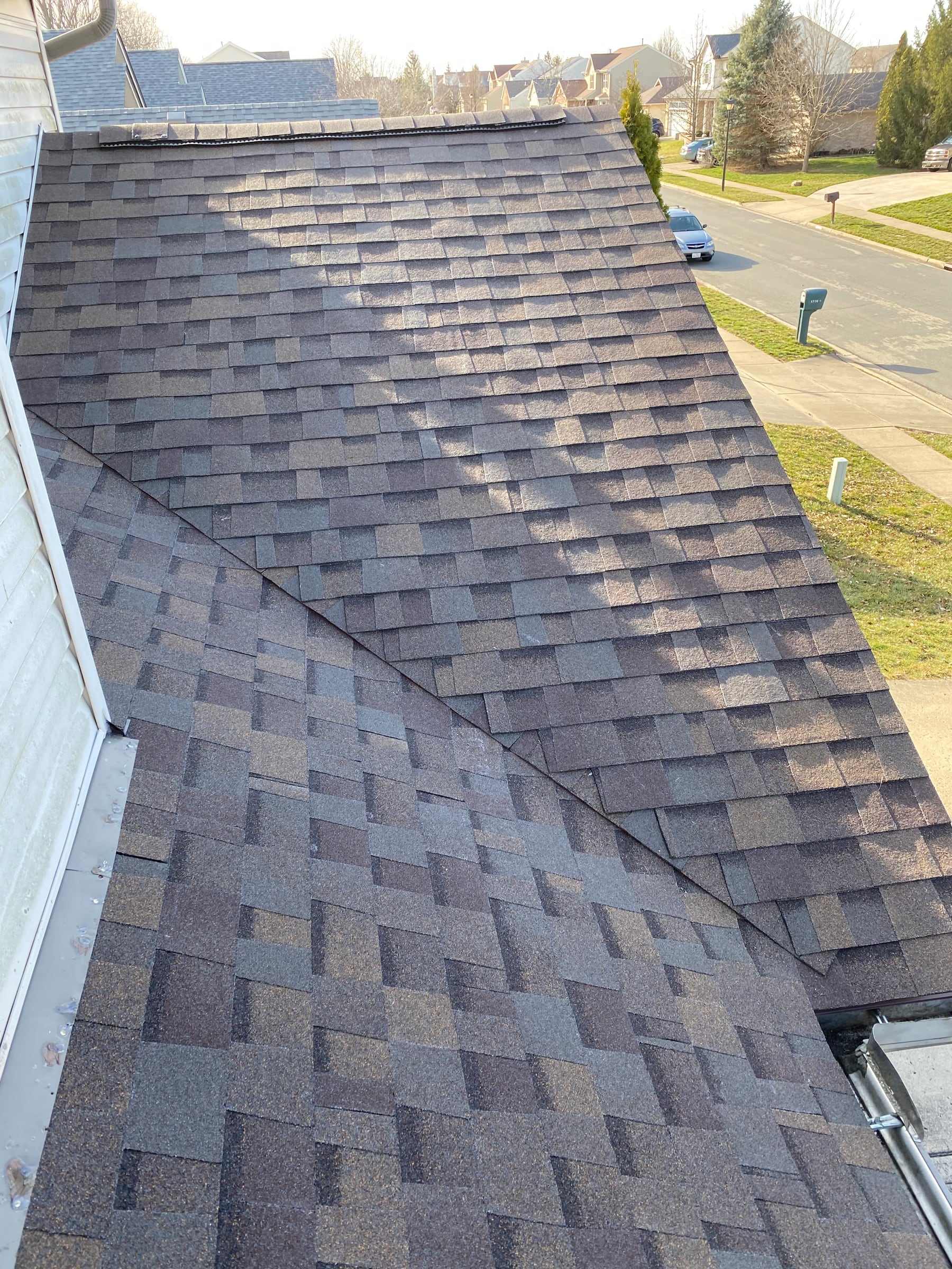 Finished shingles over the garage, with the street below, Fairborn, Ohio.