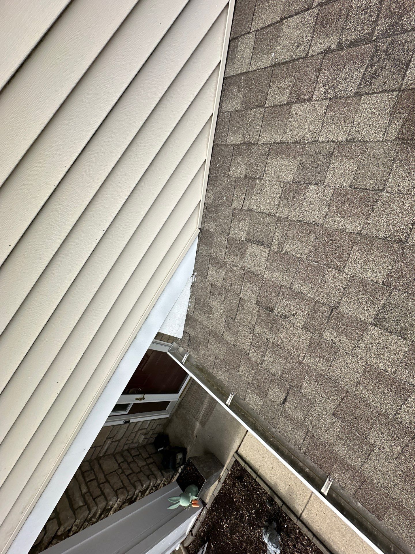 Gutter where the slope meets the wall