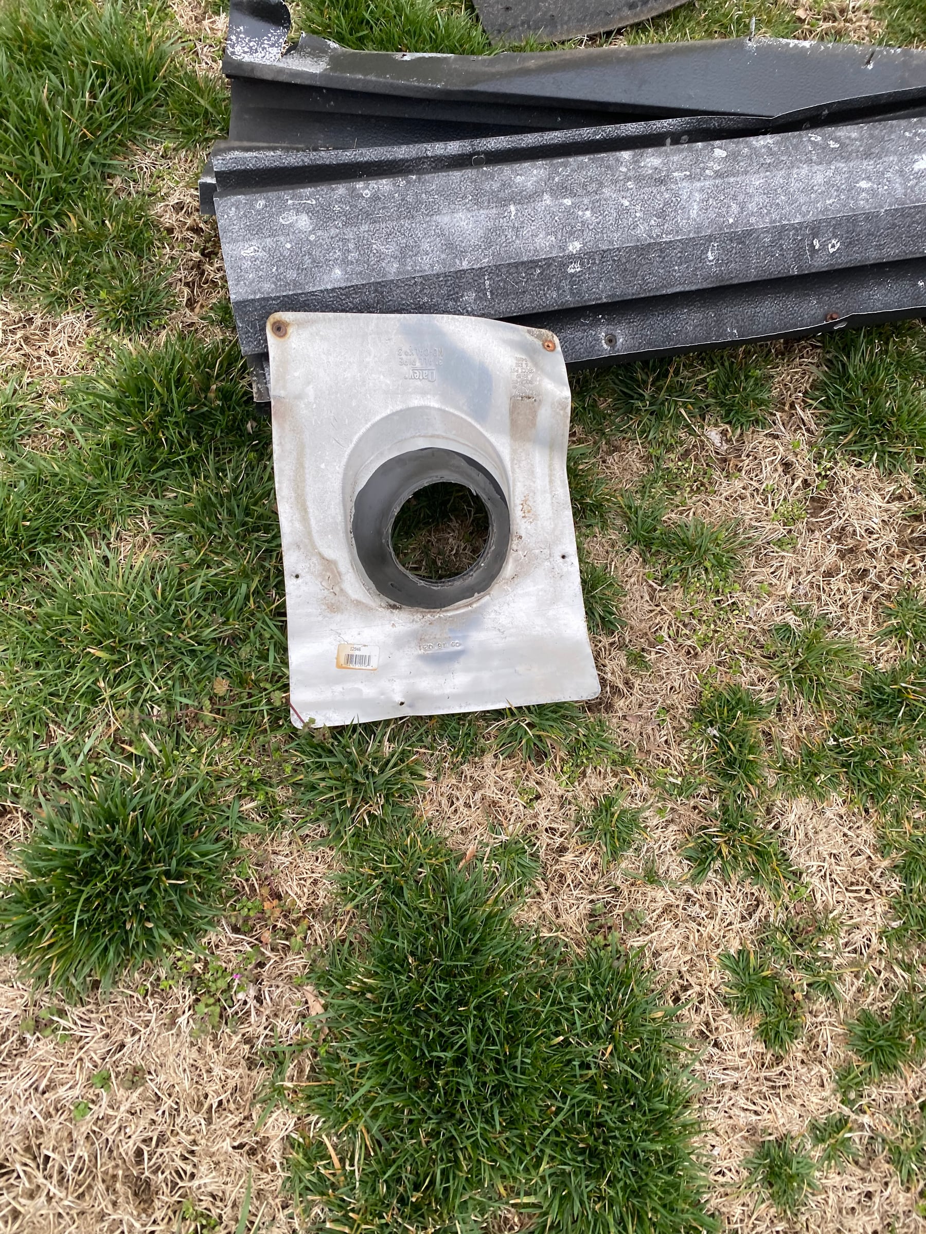 Old plastic pipe boot on the grass