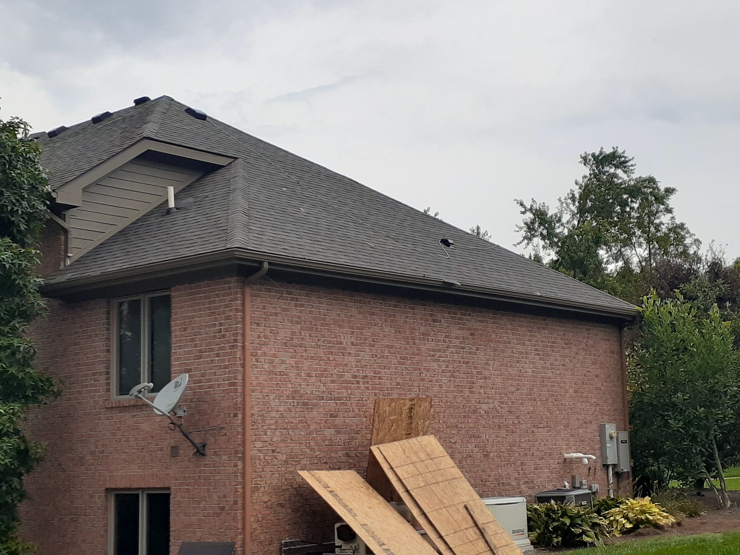Two-story brick end wall and sheathing panels