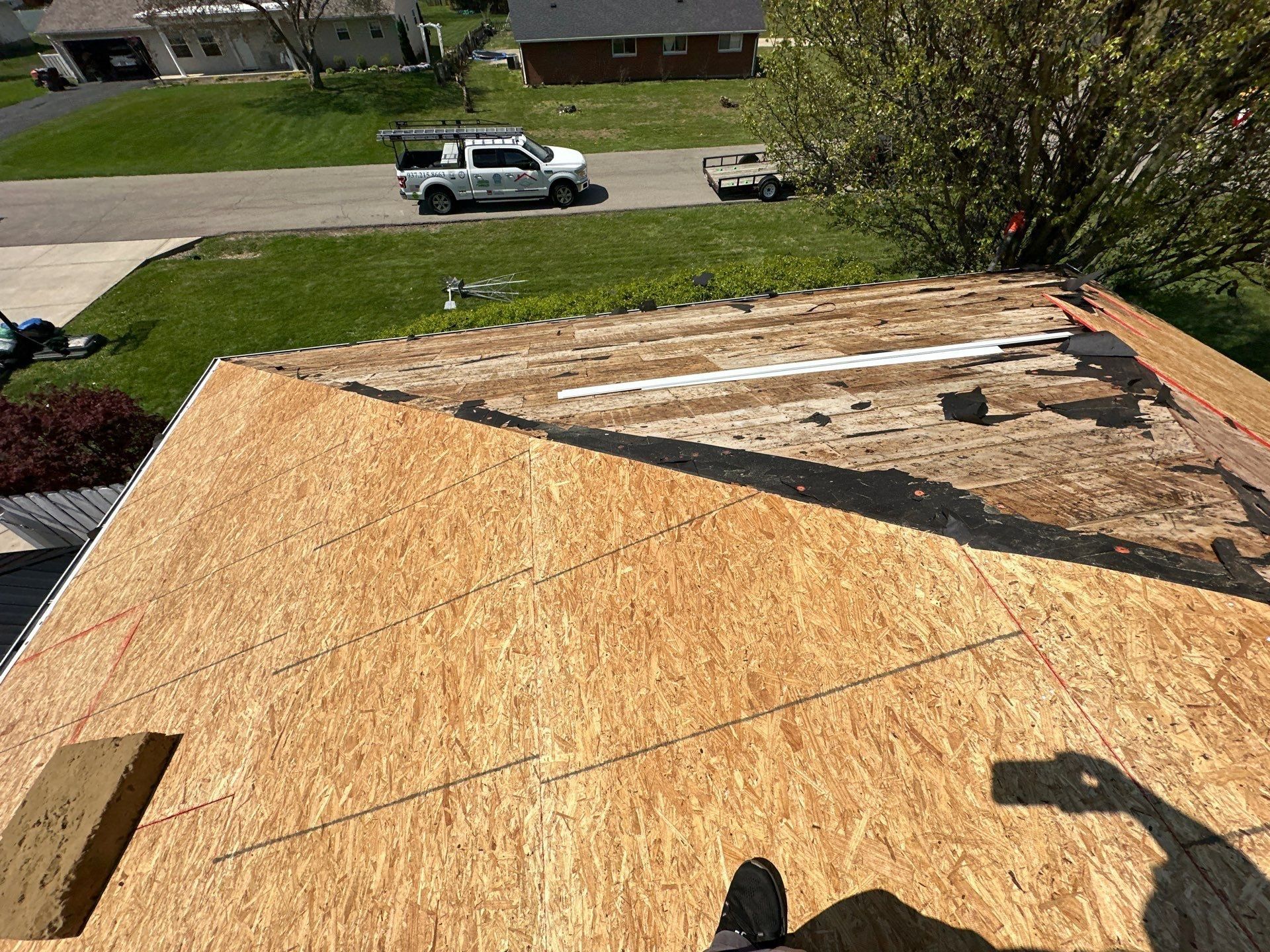 New OSB going down over the old plank decking, Beavercreek, Ohio.