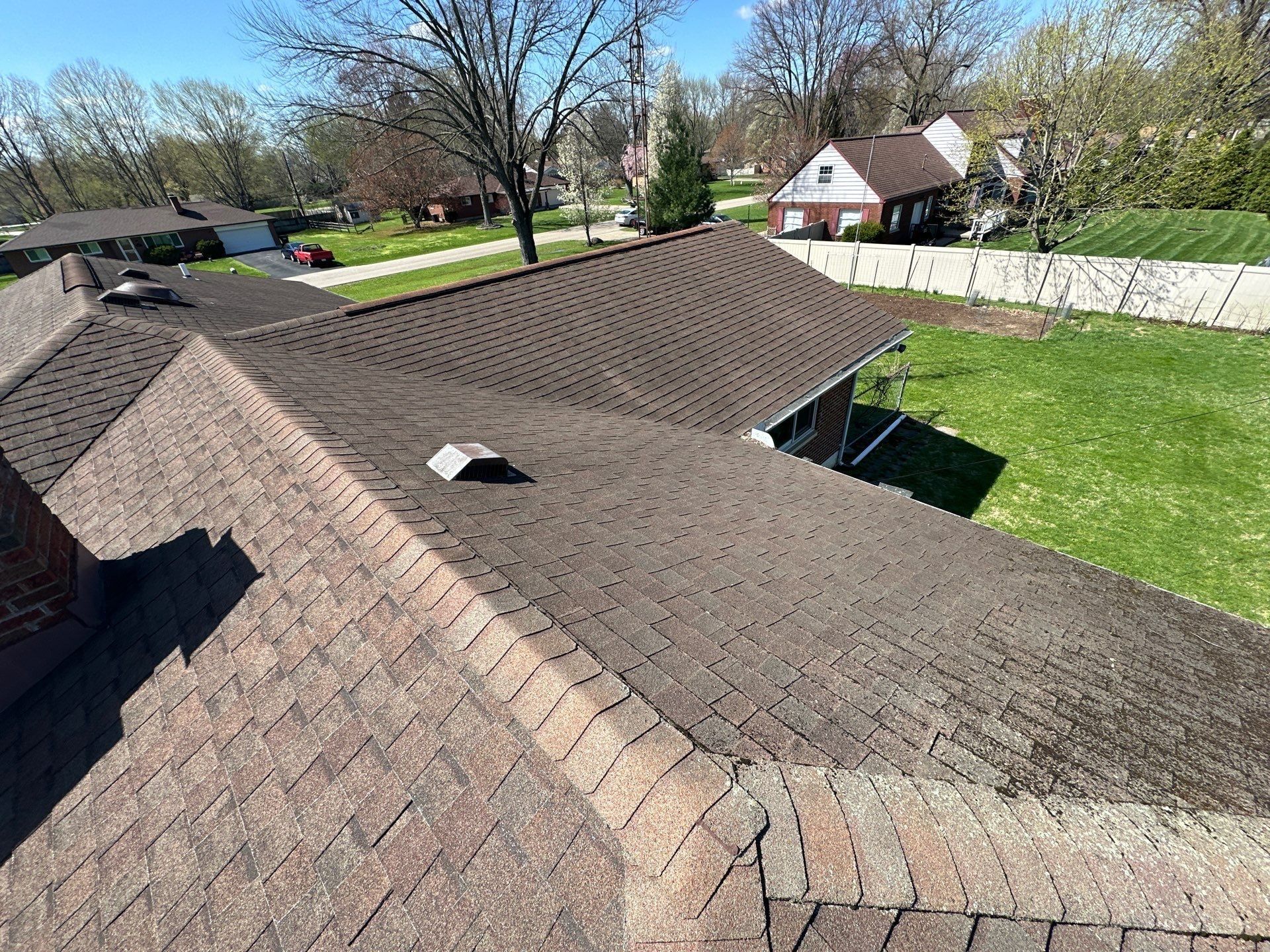 Hip roof sections of the old brown shingle roof seen from above, Beavercreek, Ohio.