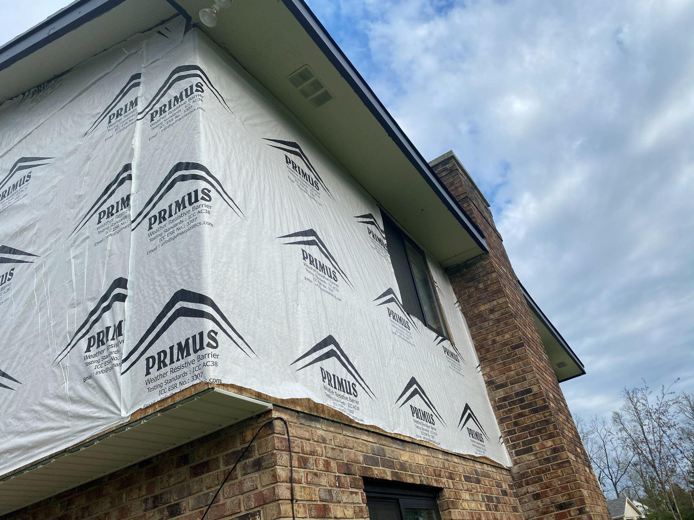 House wrap at the corner beside the chimney, Beavercreek, Ohio.