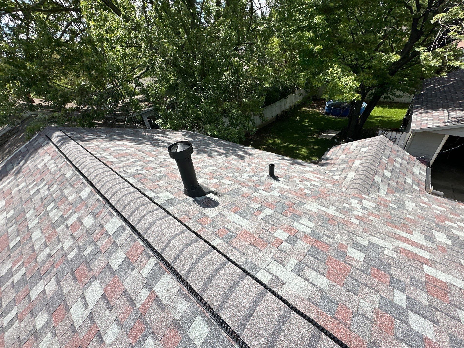 The furnace vent painted black on the finished roof, Dayton, Ohio.