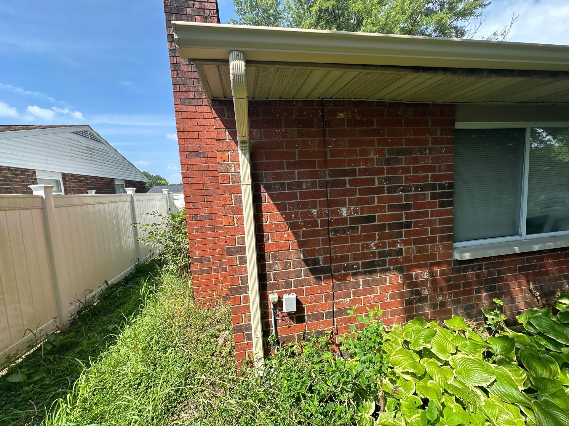 End of the house, gutter and downspout