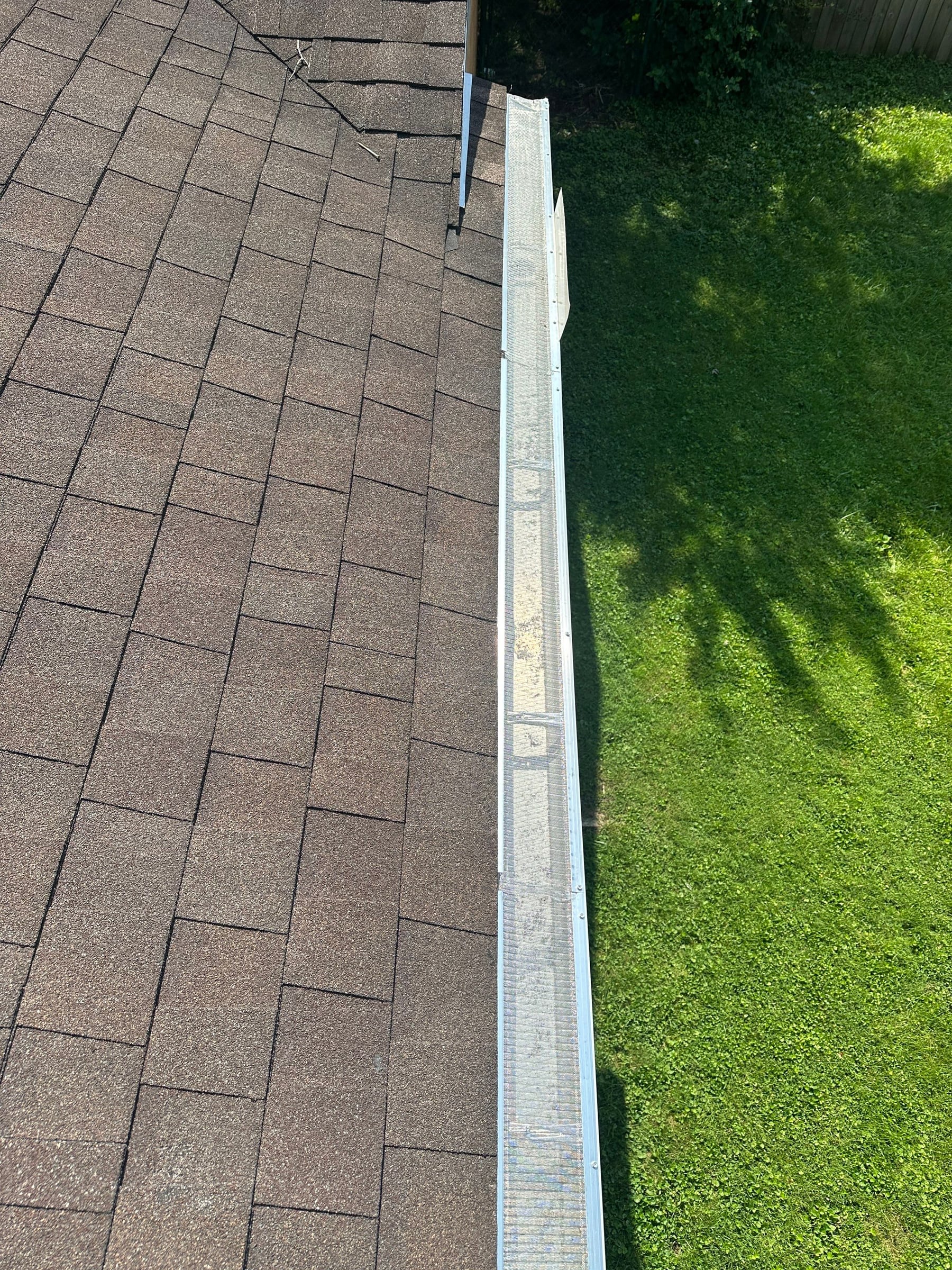 Guarded gutter above the lawn