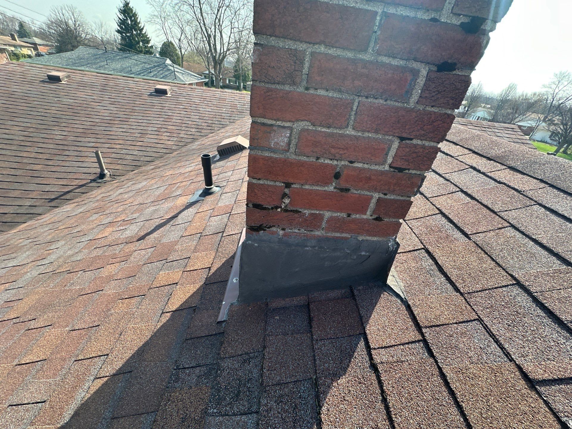 The flashing at the base of the brick chimney, Kettering, Ohio.
