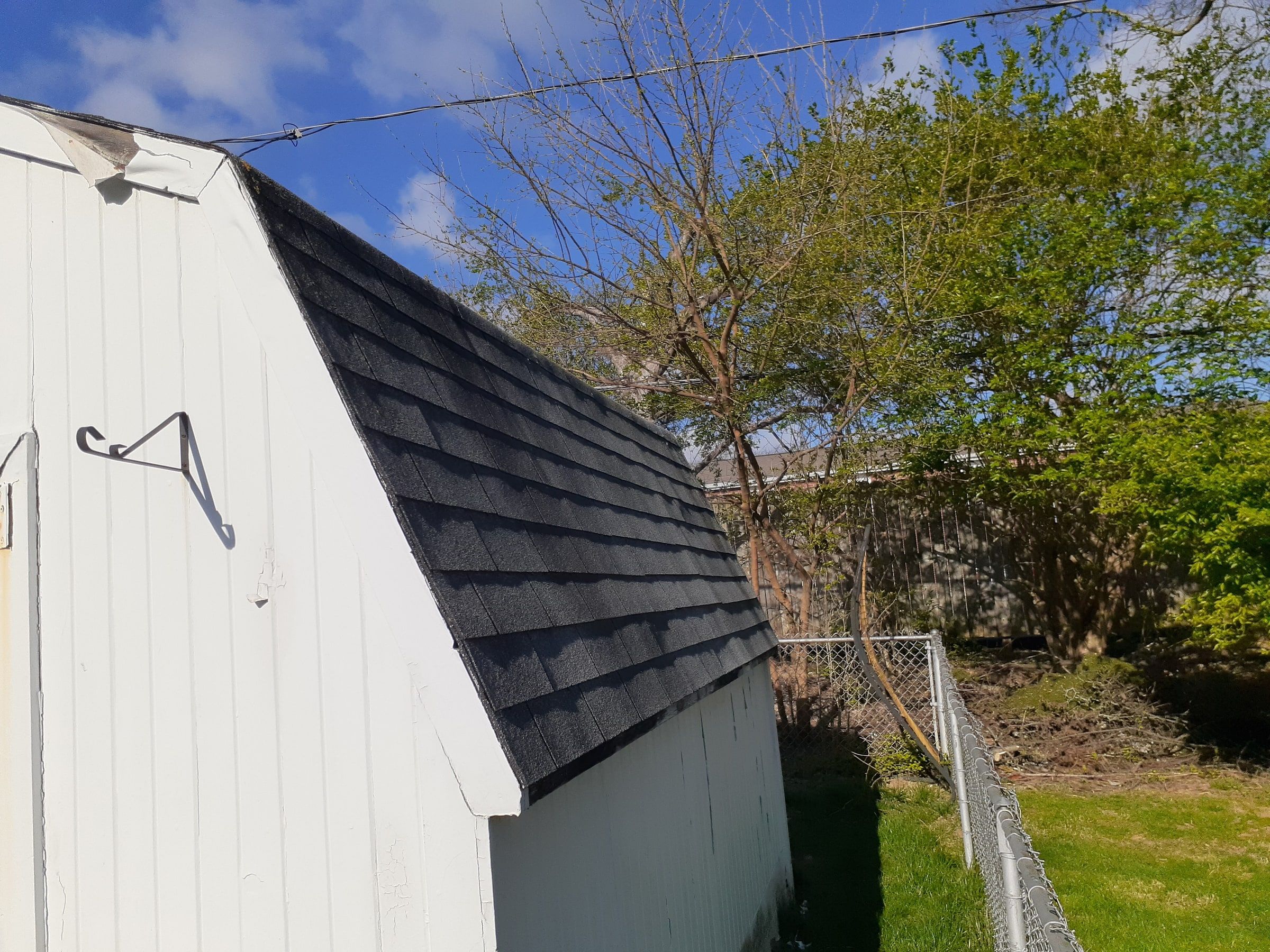 The shed roof with its old shingles before the work, Kettering, Ohio.