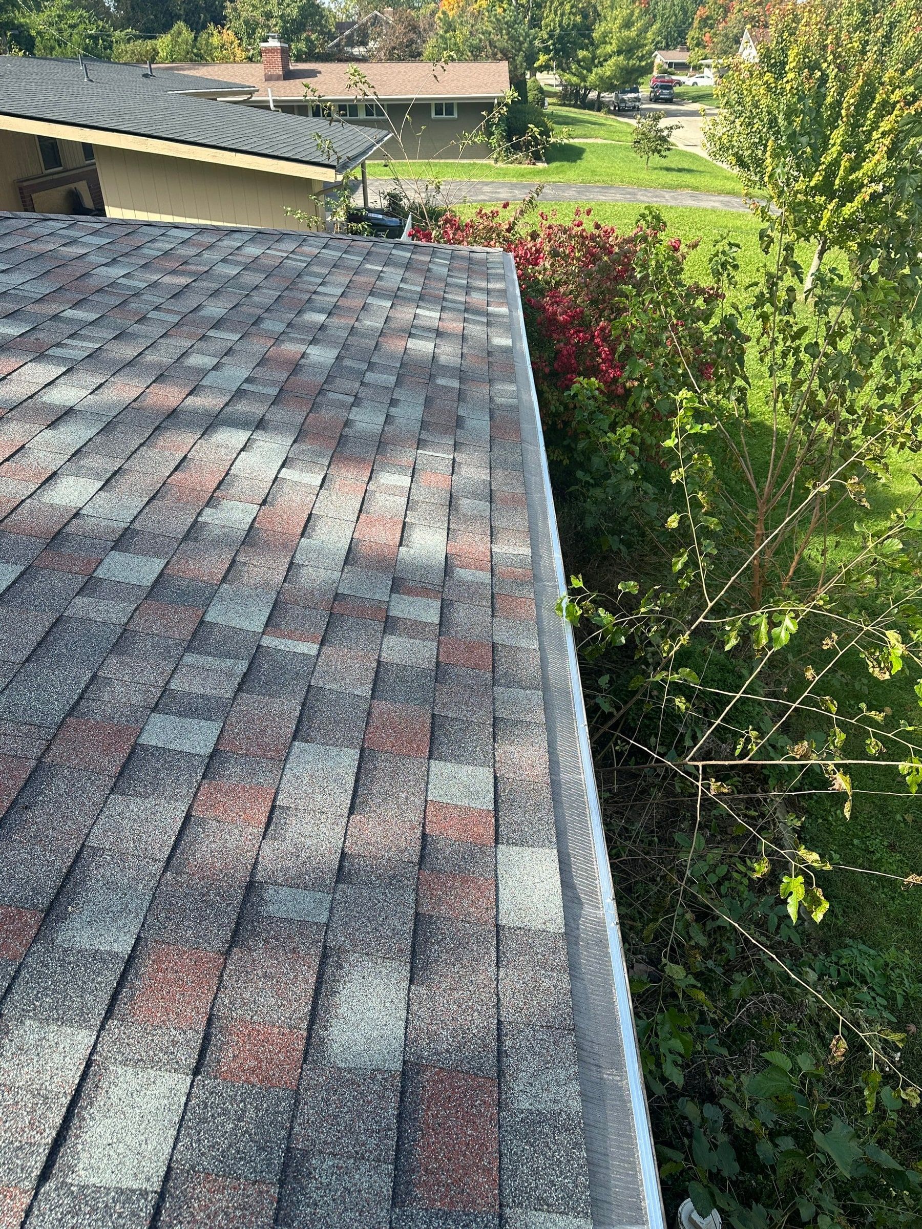 Gutter guards along the roof edge on Brubaker Dr, Kettering