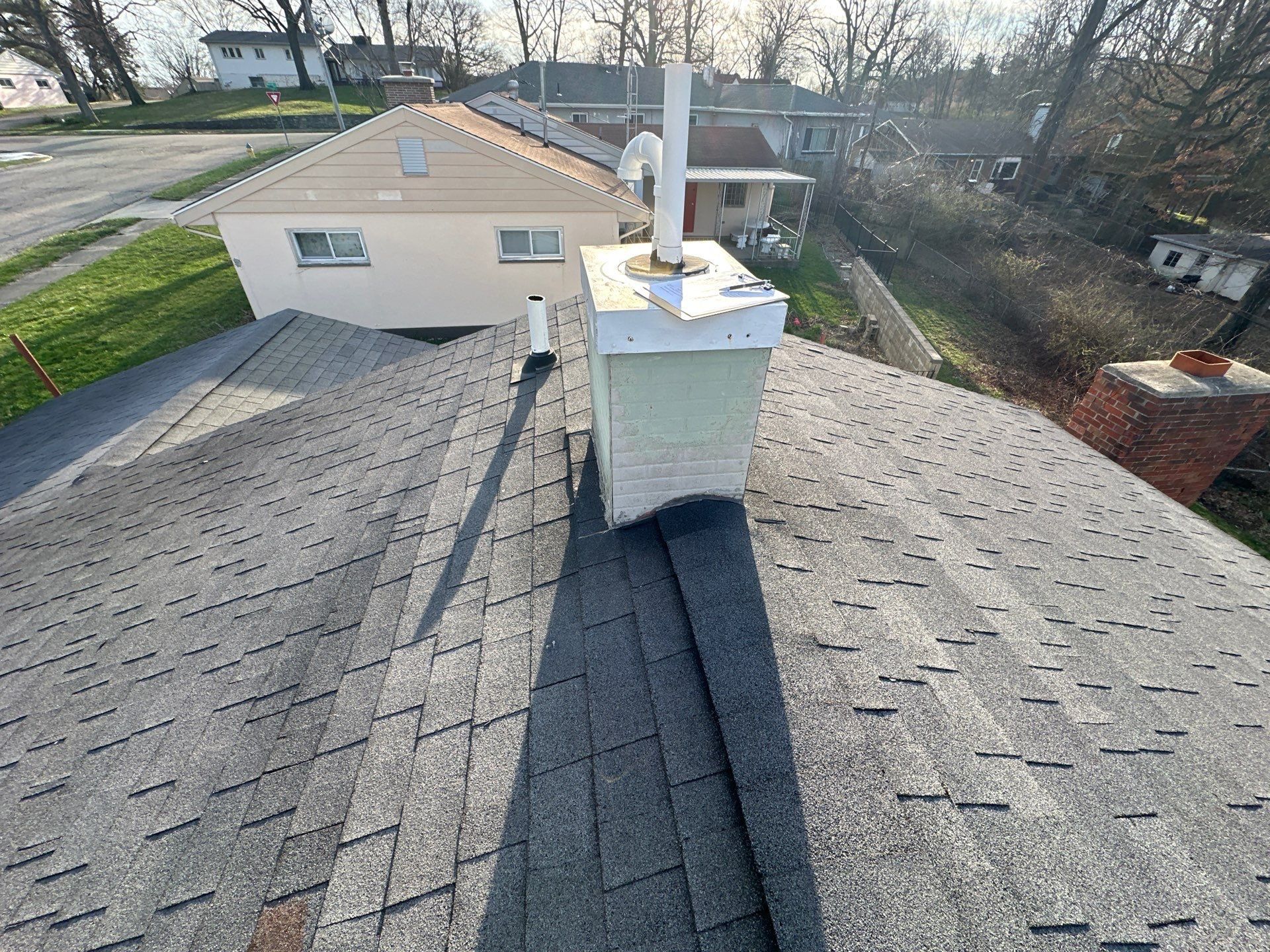 Metal-clad flue chase on the ridge