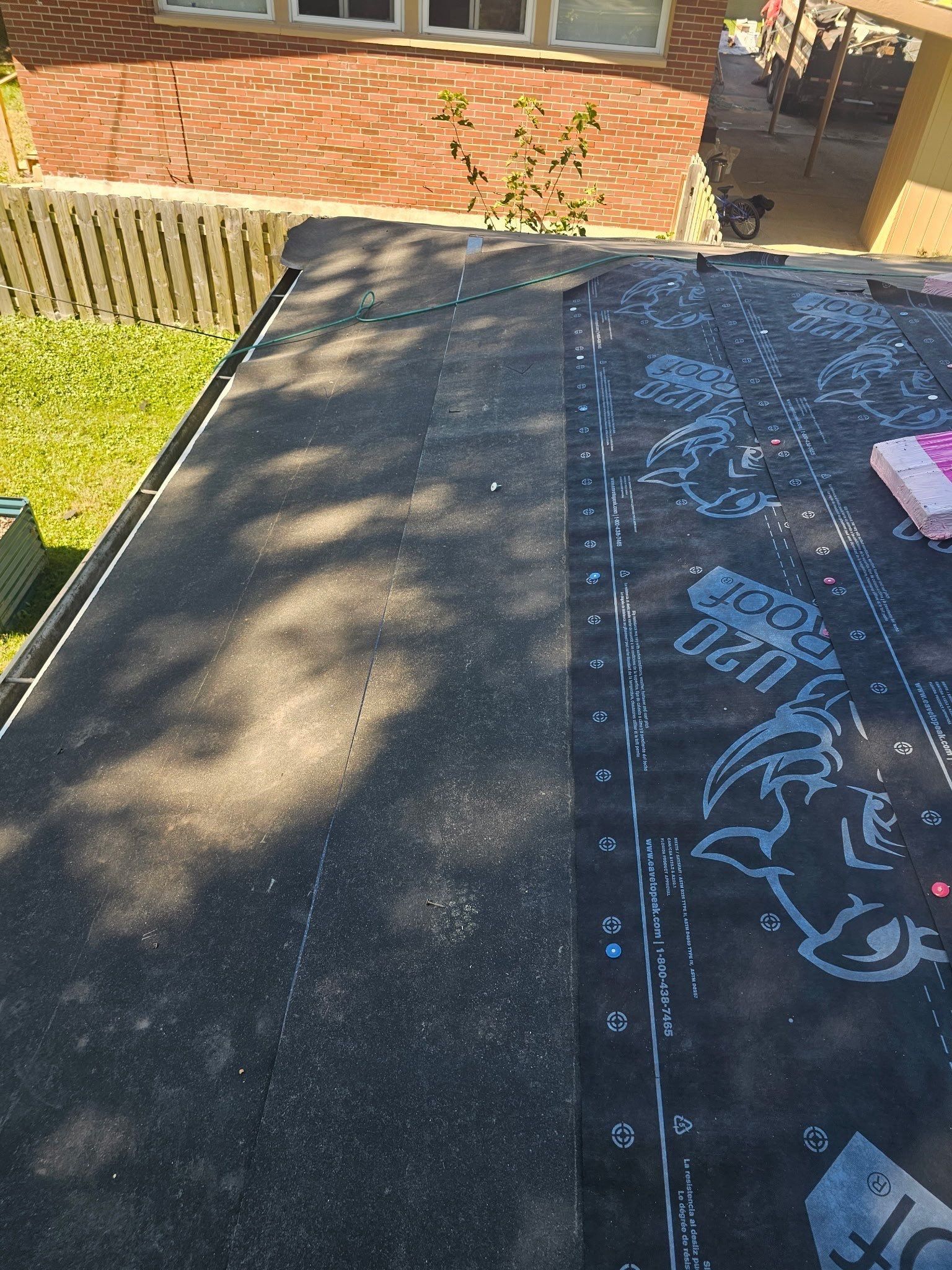 Synthetic underlayment over the back slope above the yard, Kettering, Ohio.