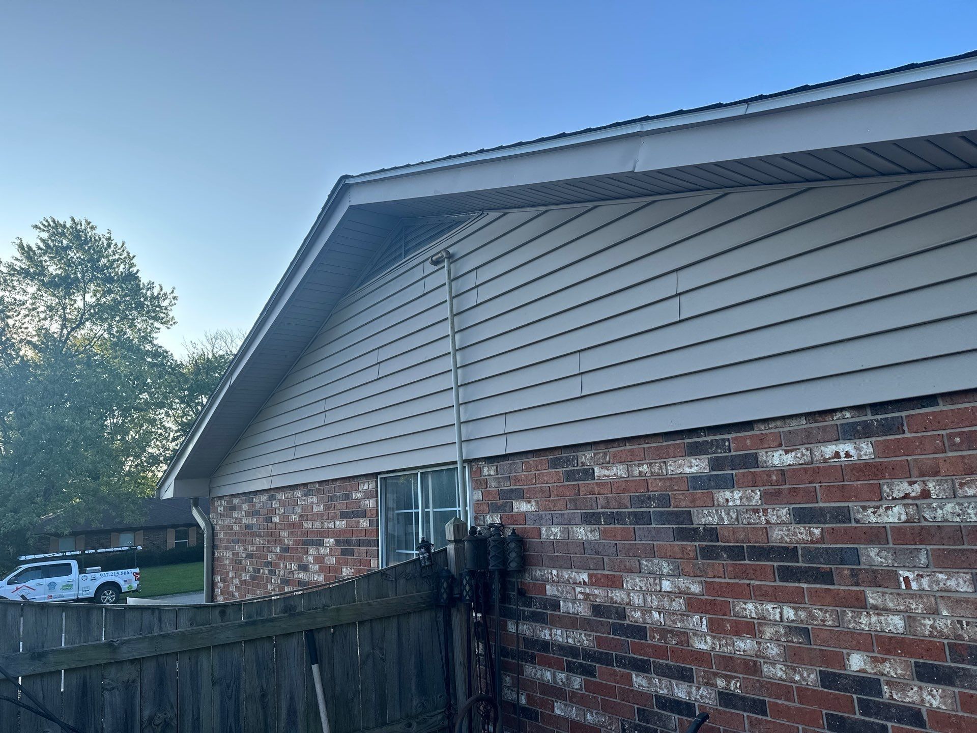 The old siding on the gable above the brick, before the work, Beavercreek, Ohio.